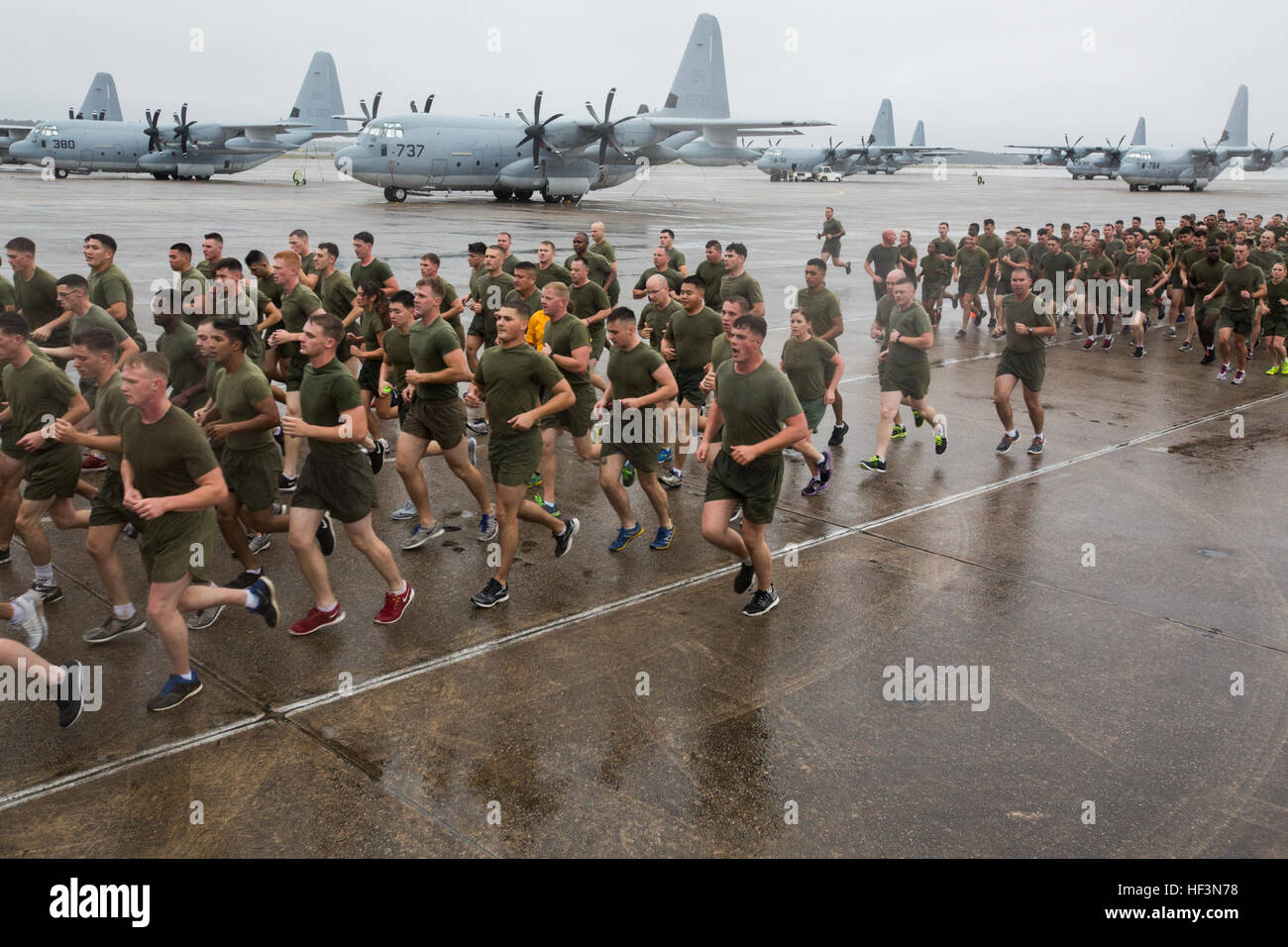 U.S. Marines and Sailors assigned to 2nd Marine Aircraft Wing participate in a formation run on Marine Corps Air Station Cherry Point, N.C., Nov. 9, 2015. The run was conducted in celebration of the Marine Corps' 240th Birthday. (U.S. Marine Corps photo by Lance Cpl. Jered T. Stone/Released) 2d MAW Birthday Run 151109-M-WP334-102 Stock Photo