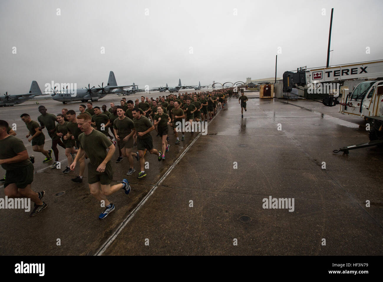 U.S. Marines and Sailors assigned to 2nd Marine Aircraft Wing participate in a formation run on Marine Corps Air Station Cherry Point, N.C., Nov. 9, 2015. The run was conducted in celebration of the Marine Corps' 240th Birthday. (U.S. Marine Corps photo by Lance Cpl. Jered T. Stone/Released) 2d MAW Birthday Run 151109-M-WP334-086 Stock Photo