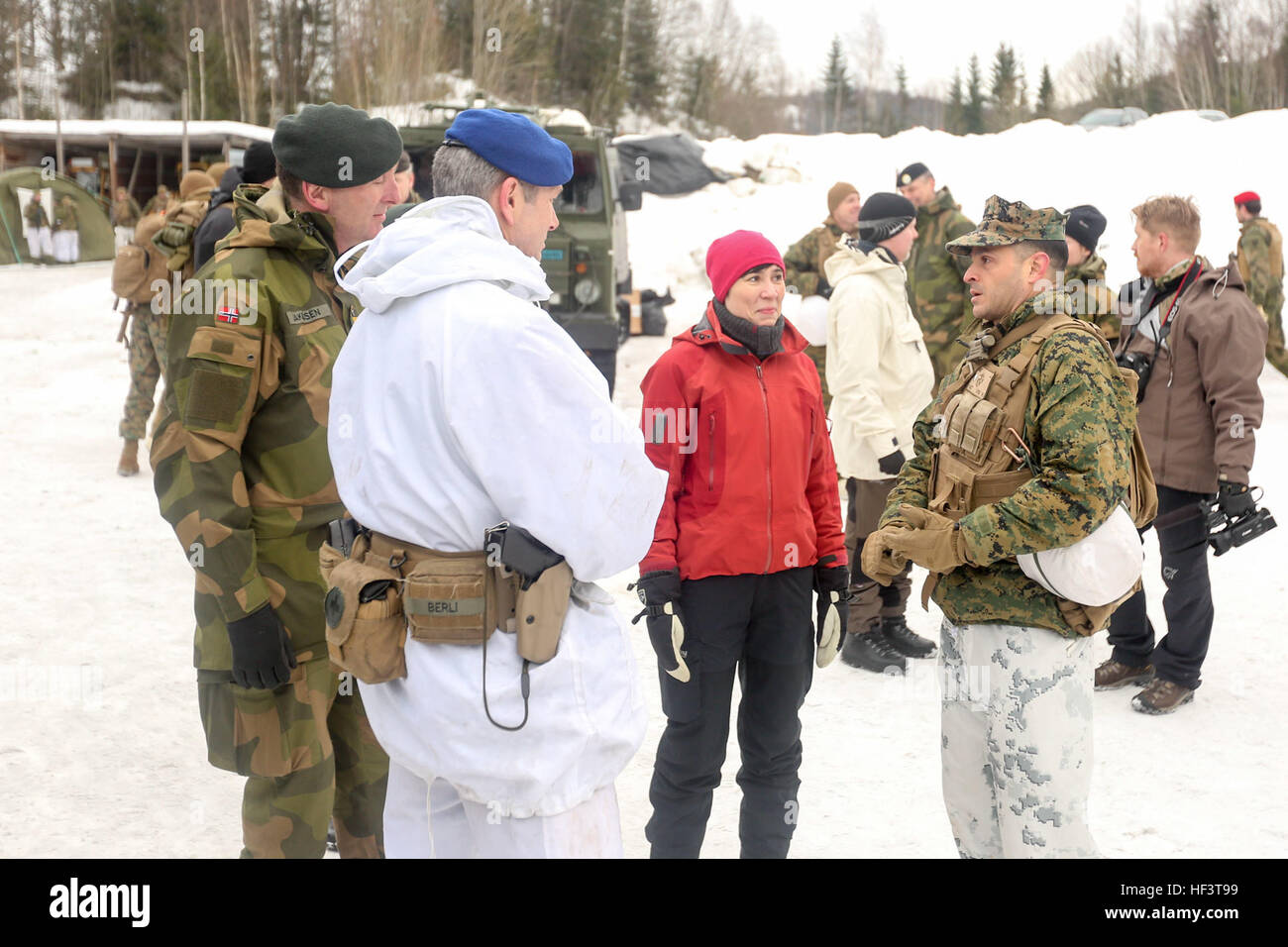 Norwegian Minister of Defense Ine Marie Eriksen Søreide talks with Lt. Col. Justin Ansel, the commanding officer of Task Force 1/8, and officers from Norway and Sweden at a training location near Steinkjer, Norway, March 2, 2016. Exercise Cold Response 16 is a multinational exercise combining the efforts of 13 NATO allies and partner nations and approximately 15,000 troops taking place across Norway. (U.S. Marine Corps photo by Cpl. Dalton A. Precht/released) Allied Strong E28093 Norwegian Minister of Defense visits Cold Response 16 forces 160302-M-WI309-024 Stock Photo