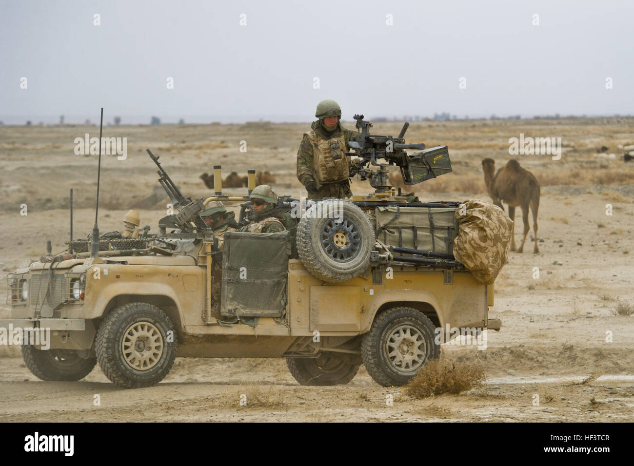 Soldiers from B Flight, 27 Squadron, Royal Air Force Regiment stop on a ...