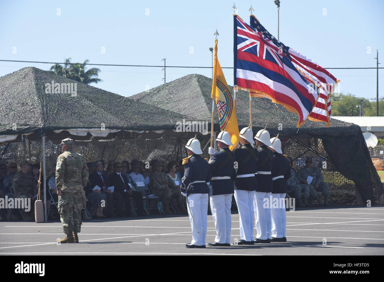 Airmen of the Royal Guard of the Hawaii National Guard dressed in ceremonial uniform present the colors to retiring Brig. Gen. Bruce E. Oliviera at the 29th Infantry Brigade Combat Team Readiness Center in Kapolei, March 5, 2016. Brig. Gen. Bruce E. Oliviera retirement ceremony 160305-Z-LP304-002 Stock Photo