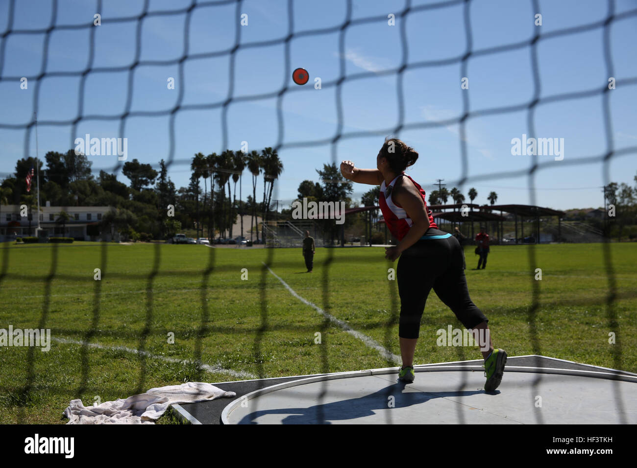 A U.S. Marine with the Wounded Warrior Regiment launches the discus during the field competition at the Marine Corps Trials aboard Marine Corps Base Camp Pendleton, Calif., March 9, 2016. The Trials, an eight-event adaptive sports competition, is hosted by the Wounded Warrior Regiment, the Marine Corps command that facilitates the integration of non-medical and medical care to wounded, ill, and injured Marines and their families. The Trials began March 2, 2016, and end March 9, 2016. (U.S. Marine Corps photo by Cpl. Jessika Acosta /Released) Marine Corps Trials- Field Competition 160309-M-ND73 Stock Photo