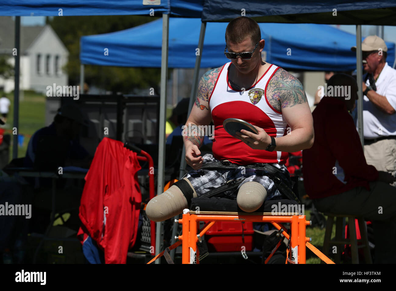 A U.S. Marine with the Wounded Warrior Regiment prepares to launch the discus during the field competition at the Marine Corps Trials aboard Marine Corps Base Camp Pendleton, Calif., March 9, 2016. The Trials, an eight-event adaptive sports competition, is hosted by the Wounded Warrior Regiment, the Marine Corps command that facilitates the integration of non-medical and medical care to wounded, ill, and injured Marines and their families. The Trials began March 2, 2016, and end March 9, 2016. (U.S. Marine Corps photo by Cpl. Jessika Acosta /Released) Marine Corps Trials- Field Competition 160 Stock Photo