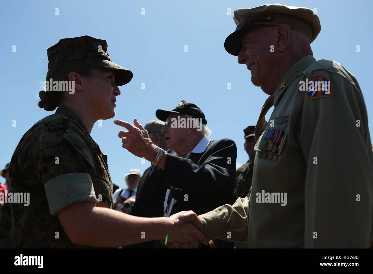 A U. S. Marine Corps Corporal, left, shakes the hand of Retired U.S. Army Air Corps Capt. Jerry Yellin , at the 71st Commemoration of the Battle of Iwo Jima at Iwo To, Japan, March 19, 2016. The Iwo Jima Reunion of Honor is an opportunity for Japanese and U.S. veterans and their families, dignitaries, leaders and service members from both nations to honor the battle while recognizing 71 years of peace and prosperity in the U.S. – Japanese alliance. (U.S. Marine Corps photo by MCIPAC Combat Camera Lance Cpl. Juan Esqueda / Released) Iwo Jima 71st Reunion of Honor 160319-M-JD520-090 Stock Photo