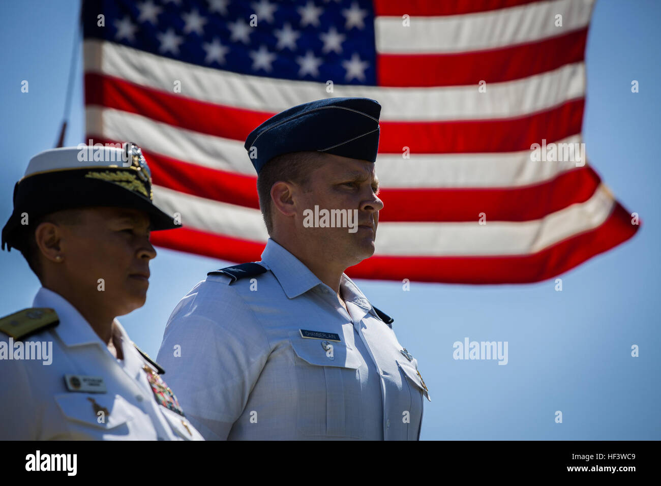 U.S. Navy Rear Adm. Babette Bolivar, left, Commander, Naval Forces Marianas, Guam, and U.S. Air Force Col. Tyrell Chamberlain, vice commander, 36th Wing, participate in the 71st Commemoration of the Battle of Iwo Jima at Iwo To, Japan, March 19, 2016. The Iwo Jima Reunion of Honor is an opportunity for Japanese and U.S. veterans and their families, dignitaries, leaders and service members from both nations to honor the battle while recognizing 71 years of peace and prosperity in the U.S. – Japanese alliance. (U.S. Marine Corps photo by MCIPAC Combat Camera Lance Cpl. Juan Esqueda / Released) I Stock Photo