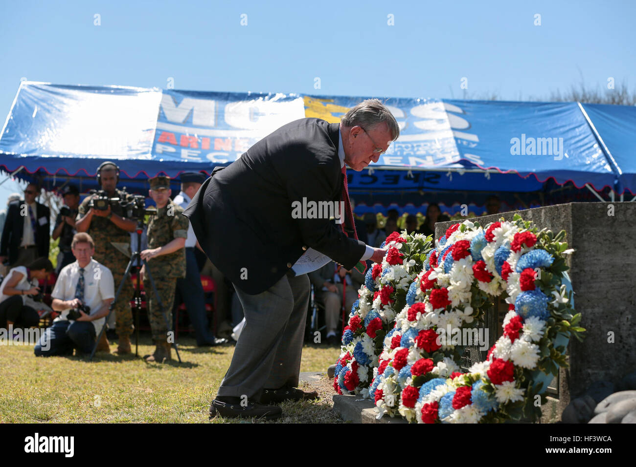 Retired U.S. Marine Corps Col. Warren Wiedhahn, Executive Vice President of the Iwo Jima Association of America, lays a wreath during the 71st Reunion of Honor Ceremony at Iwo To, Japan, March 19, 2016. The Iwo Jima Reunion of Honor is an opportunity for Japanese and U.S. veterans and their families, dignitaries, leaders and service members from both nations to honor the battle while recognizing 71 years of peace and prosperity in the U.S. – Japanese alliance. (U.S. Marine Corps photo by MCIPAC Combat Camera Lance Cpl. Juan Esqueda / Released) Iwo Jima 71st Reunion of Honor 160319-M-JD520-221 Stock Photo