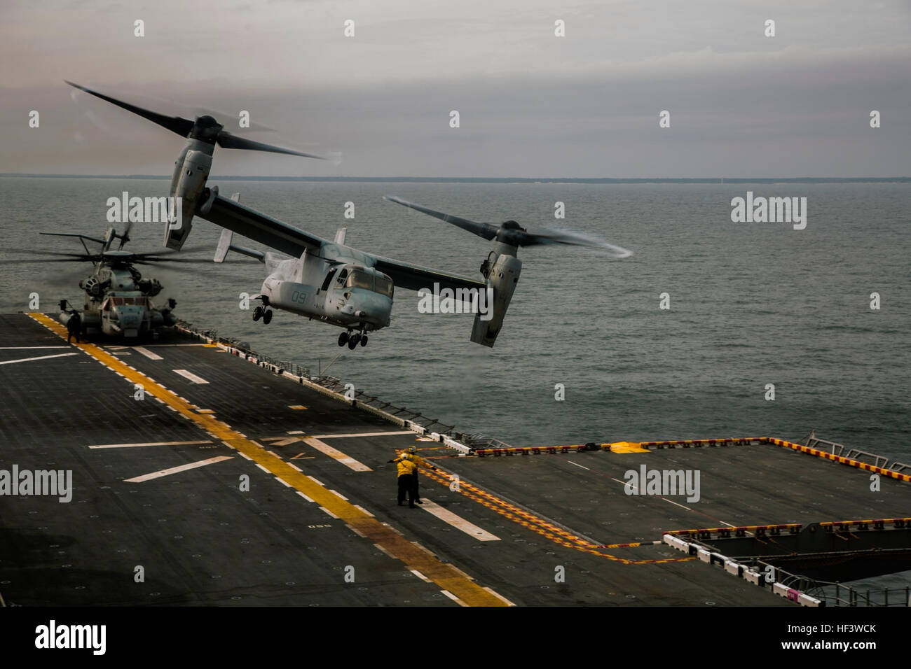 ATLANTIC OCEAN ((March 19, 2016) U.S. Marines assigned to Battalion Landing Team, 1st Battalion, 6th Marine Regiment (BLT 1/6), 22nd Marine Expeditionary Unit (22nd MEU)and Sailors assigned to the amphibious assault ship USS Wasp (LHD 1) simulate launching a heavy package aviation raid with Marine Medium Tiltrotor Squadron 264 (Reinforced). The 22nd MEU and Amphibious Squadron Six (PHIBRON-6) are underway for PHIBRON/MEU Integration Training. (U.S. Marine Corps photo by Cpl. Ryan G. Coleman/Released)160319-M-BE869-118 Join the conversation: http://www.navy.mil/viewGallery.asp http://www.facebo Stock Photo