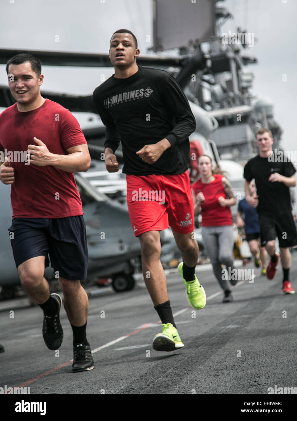 At sea. (March 27, 2016)-U.S. Marines and Sailors with the 13th Marine Expeditionary Unit and Boxer Amphibious Ready Group, participate in a 5k run for women's history month, March 27, 2016, during the MEU's western pacific deployment aboard the USS Boxer. More then 4,500 Marines and Sailors from the Boxer ARG, 13th MEU team are currently transiting the Pacific Ocean toward the U.S. 5th fleet area of operations during a scheduled deployment. (U.S. Marine Corps photo by Sgt. Briauna Birl/RELEASED) Women's History 5k aboard USS Boxer 160327-M-KR317-209 Stock Photo