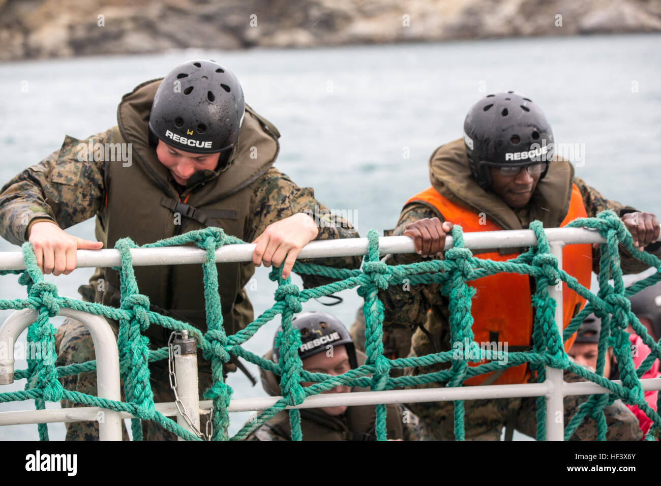 U.S. Marine Lance Cpl. Jeremy L. Fultz, (left), mortar man, and Lance Cpl. Jeremiah D. Patterson, (right), rifleman, both with Bravo company, 1st Battalion, 8th Marine Regiment, Special Purpose Marine Air-Ground Task Force-Crisis Response-Africa climb from a zodiac rescue boat onto a passenger transport boat during a French Commando boat evacuation training event in Collioure, France, Apr. 8, 2016. The French Commando training allows SPMAGTF-CR-AF Marines to train alongside French forces and share knowledge as well as build a partnership that will help enable the crisis response mission. (U.S. Stock Photo