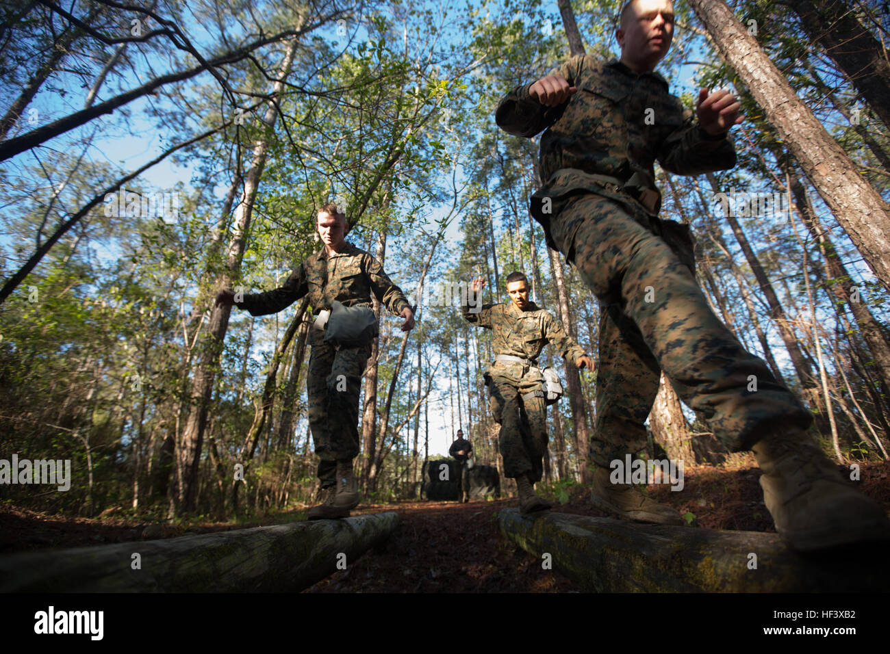 Marines with the 24th Marine Expeditionary Unit run through an obstacle course as part of their chemical, biological, radiological, and nuclear training at Camp Lejeune, N.C., April 13, 2016. The training provides Marines with a basic knowledge of how to don and clear a gas mask to effectively defend against chemical or biological assaults. (U.S. Marine Corps photo by Cpl. Todd F. Michalek) 24th MEU conducts CBRN training 160413-M-YH418-001 Stock Photo