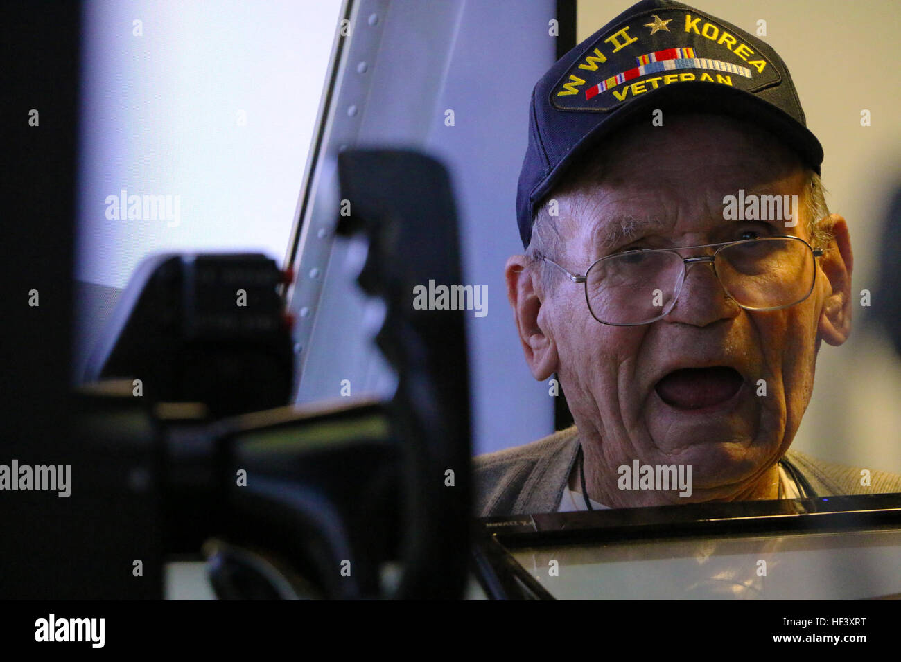 Members of the 179th Airlift Wing, Mansfield, Ohio, hosted veterans from the Knox County Joint Veterans Council to a tour of the installation, April 20, 2015. The veterans are given the opportunity to fly the Multi-Mission Crew Trainer (MMCT) simulating the flight of a C-130H Hercules as well as a tour of the actual aircraft and flight equipment. The group consisited of veterans of Vietnam, Korea and World War II and represented several branches including Army, Air Force, Navy and Marines. The Ohio Air National Guard unit is always on mission to respond with highly qualified citizen-airmen to  Stock Photo