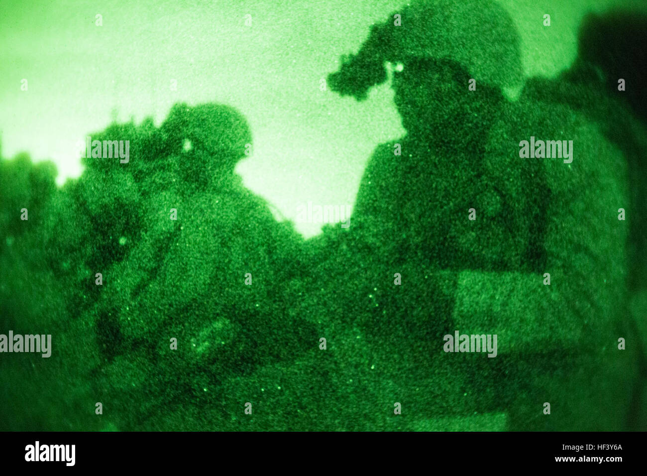 Marines wait to move into an enemy compound during a night raid training evolution aboard Marine Corps Base Camp Pendleton, Calif., April 28, 2016. A raid is one of a Marine Expeditionary Unit’s 13 mission essential tasks, which a Battalion Landing Team will constantly refine prior to their designated deployment. The Marines are with the Light Armored Reconnaissance company of BLT, 1st Bn., 4th Marines, 11th MEU. Light Armored Reconnaissance Raid 160428-M-KJ317-119 Stock Photo