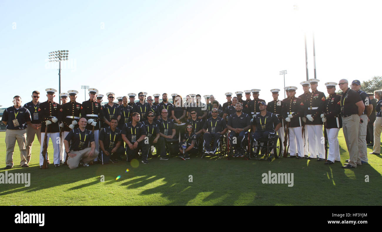Members of the U.S Marine Corps Silent Drill Platoon pose with U.S. Marines, Sailors, and staff with the Wounded Warrior Regiment before the opening ceremony of the 2016 Invictus Games at the ESPN Wide World of Sports in Oralndo, Fla., May 8, 2016. The Invictus Games is an international adaptive sports competition for wounded, ill, and injured Service members and veterans. (U.S. Marine Corps Photo by Capt. Andrew Bolla/Released) 2016 Invictus Games Opening Ceremony Meet & Greet 160508-M-WH399-040 Stock Photo