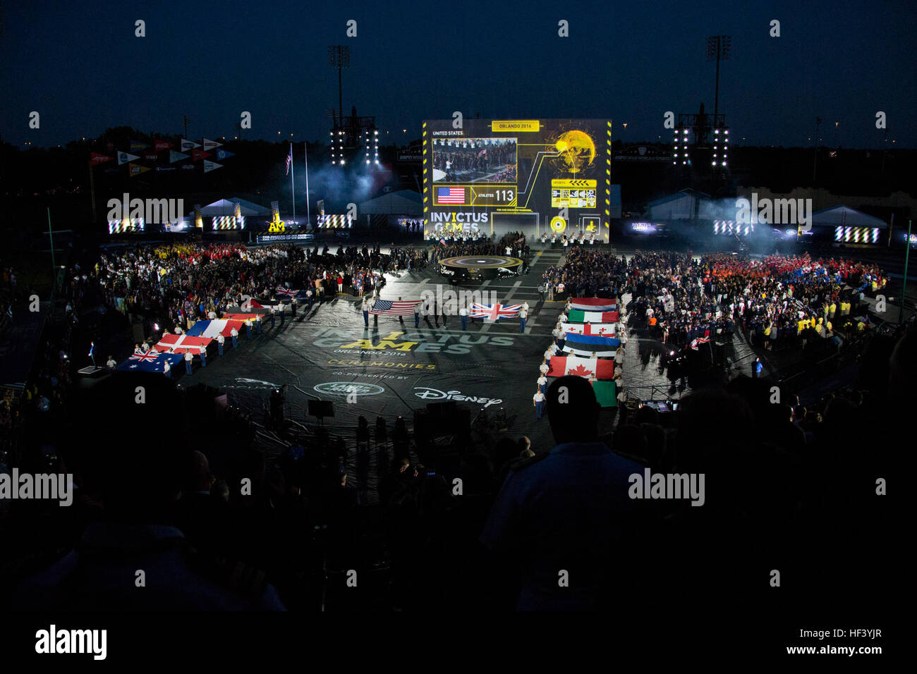 The flags of the countries participating in the Invictus Games are presented in the arena during the opening ceremony at the ESPN Wide World of Sports Complex, Orlando, Fla., May 8, 2016. This year's games feature 500 wounded or injured service members from 14 nations competing in 10 adaptive sporting events. (U.S. Marine Corps photo by Staff Sgt. Gabriela Garcia/Released) CMC at the Invictus Games 160509-M-SA716-103 Stock Photo