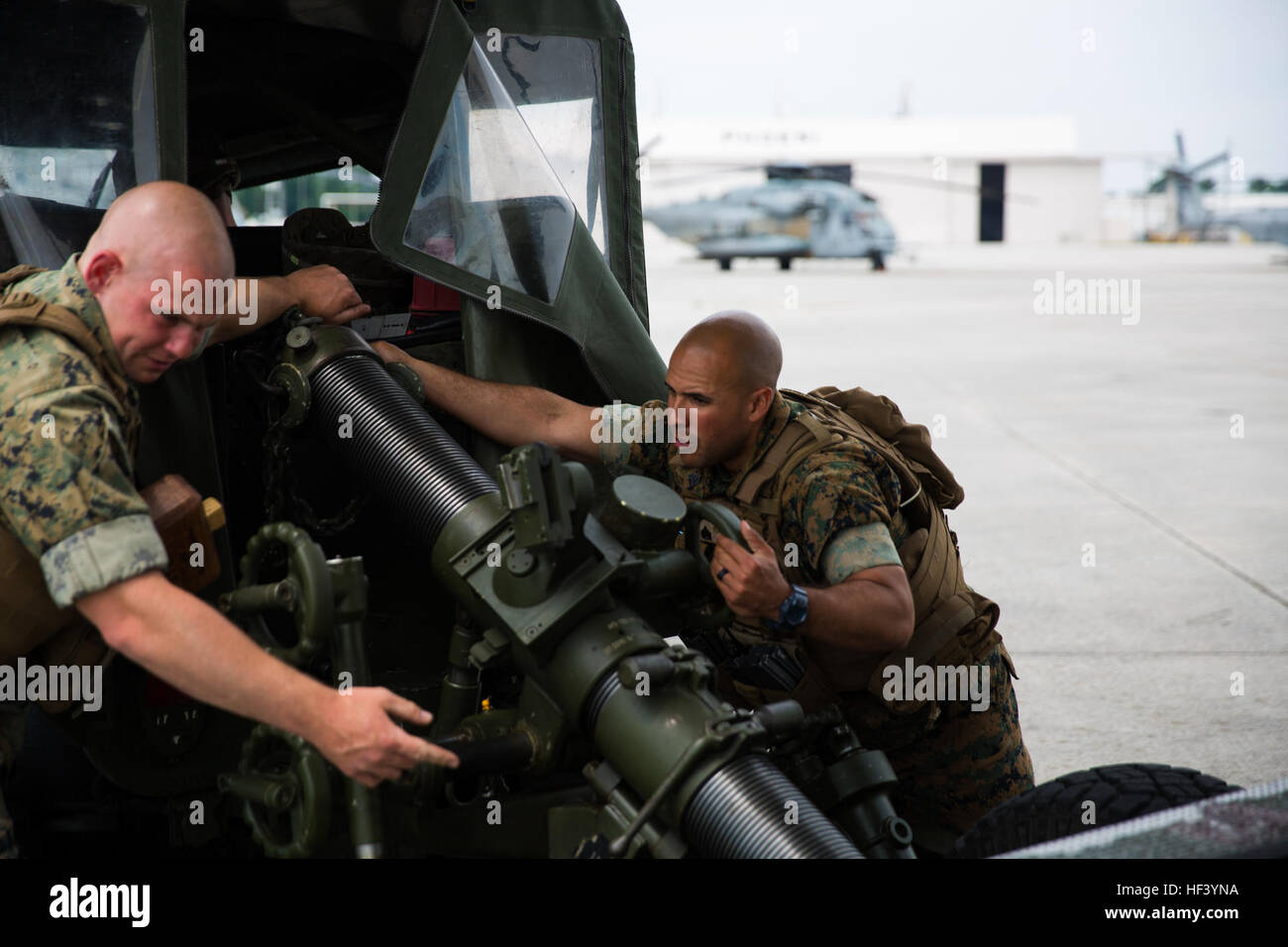 U.S. Marines assigned to 1st Battalion, 10th Marine Regiment, Alpha Battery, mount a 120mm mortar onto an internal transport vehicle at Marine Corps Air Station New River, N.C., May 10, 2016. Loading the vehicle into a CH-53E Super Stallion was a practical application in preparation for an upcoming field training exercise. (U.S. Marine Corps photo by Cpl. Jodson B. Graves/Released) HMH-464 Load Exercise 160510-M-SW506-0211 Stock Photo