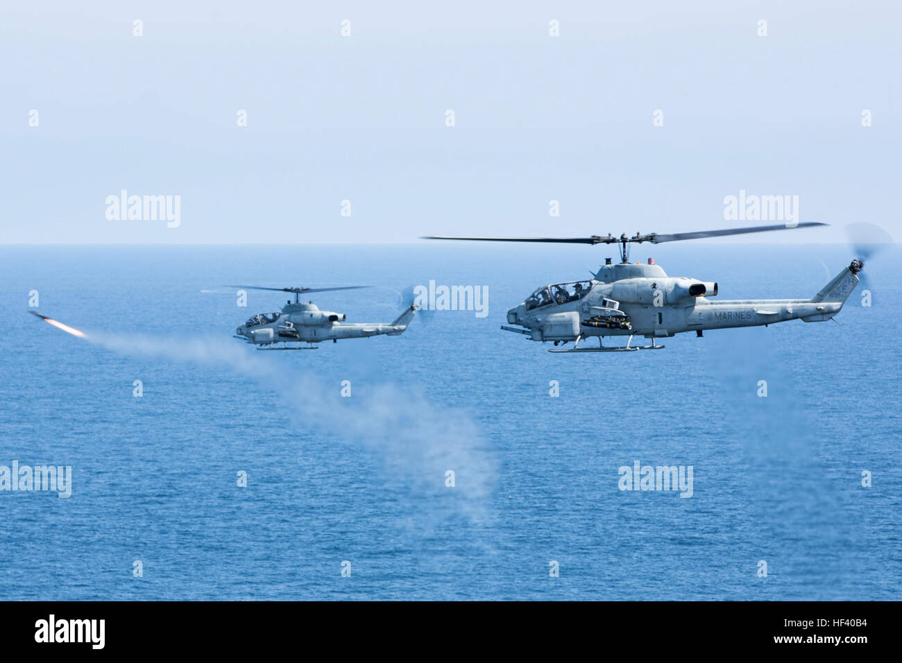 A section of AH-1W Super Corbras with Marine Medium Tiltrotor Squadron 264 (Reinforced), 22nd Marine Expeditionary Unit (MEU), shoots Hellfire missiles during composite training unit exercise (COMPTUEX), May 18, 2016. The MEU and Amphibious Squadron Six (PHIBRON-6) are underway for composite training unit exercise (COMPTUEX). (U.S. Marine Corps photo by Cpl. John A. Hamilton Jr./ 22nd Marine Expeditionary Unit / Released) 22nd MEU ACE Shoots Hellfire Missiles (Image 1 of 4) 160518-M-MK246-169 Stock Photo