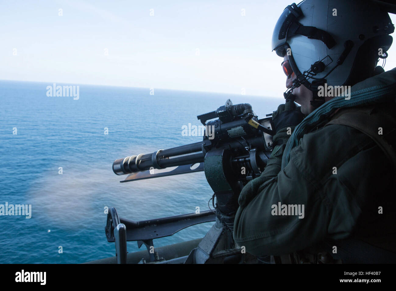 U.S. Marine Sgt. Jeremiah Hammond with Marine Medium Tiltrotor Squadron 264 (Reinforced), 22nd Marine Expeditionary Unit (MEU), fires a GAL 21 .50 caliber machine gun during composite training unit exercise (COMPTUEX), May 18, 2016. The MEU and Amphibious Squadron Six (PHIBRON-6) are underway for composite training unit exercise (COMPTUEX). (U.S. Marine Corps photo illustration by Cpl. John A. Hamilton Jr./ 22nd Marine Expeditionary Unit / Released) 22nd MEU ACE Shoots Hellfire Missiles 160518-M-MK246-174 Stock Photo