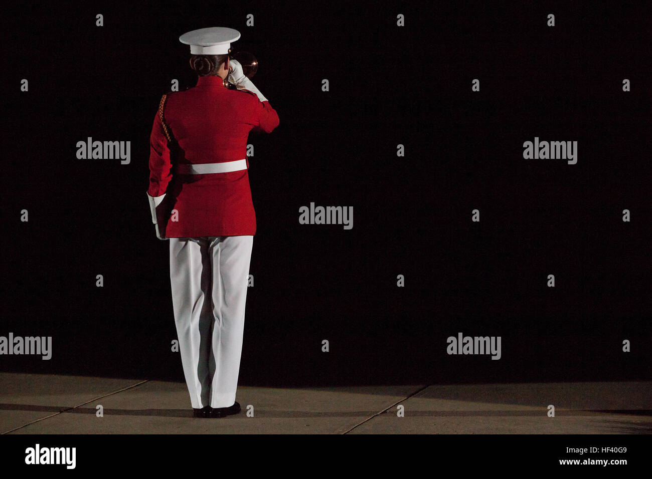 U.S. Marine Corps Staff Sgt. Codie Williams, ceremonial bugler, Marine Barracks Washington (MBW), performs during an evening parade at MBW, Washington, D.C., May 20, 2016. The evening parade summer tradition began in 1934 and features the Silent Drill Platoon, the U.S. Marine Band, the U.S. Marine Drum and Bugle Corps and two marching companies. More than 3,500 guests attend the parade every week. (U.S. Marine Corps photo by Lance Cpl. Hailey D. Stuart/Released) Marine Barracks Washington Evening Parade May 20, 2016 160520-M-LR229-154 Stock Photo