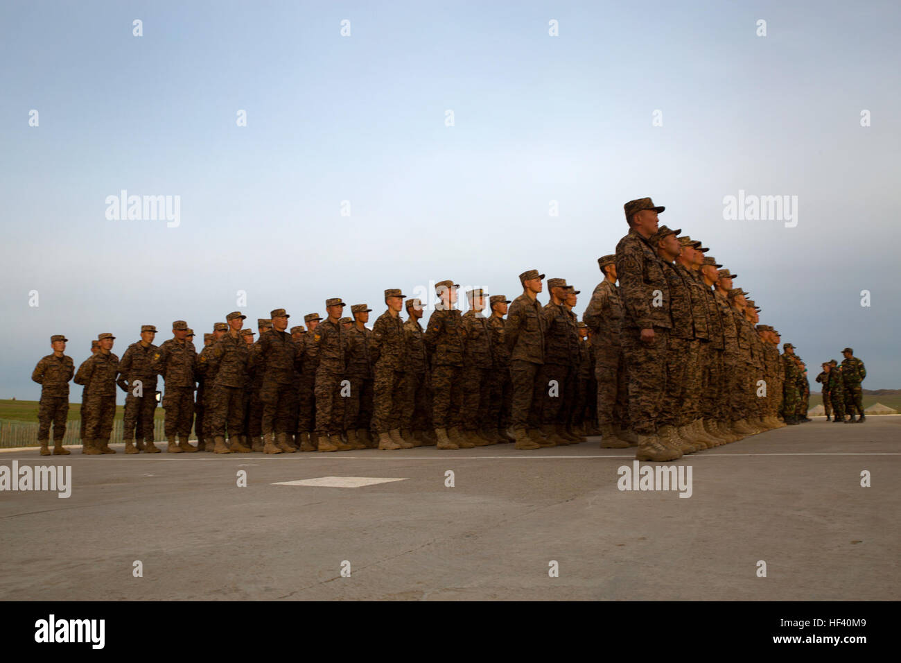Members of the Mongolian Armed Forces stand in formation before the Khaan Quest 2016 opening ceremonies May 22 at Five Hills Training Area, Ulaanbaatar, Mongolia. Khaan Quest 2016 is an annual multinational peacekeeping operations exercise conducted in Mongolia and is the capstone exercise for the Global Peace Operations Initiative. (U.S. Marine Corps Photo by Cpl. Janessa K. Pon) Multinational Peacekeeping Exercise Khaan Quest 2016 commences with opening ceremony (Image 1 of 15) 160521-M-TA471-0085 Stock Photo