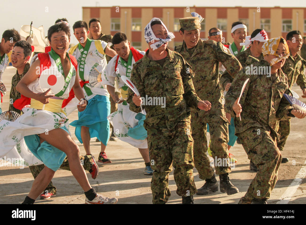 Members of the Japan Ground Self-Defense Force (JGSDF) perform a traditional dance at Five Hills Training Area, Mongolia, during an Exercise Khaan Quest 2016 cultural night, May 27. Khaan Quest cultural nights are hosted throughout the exercise and foster togetherness among the participating countries through the sharing of traditions and customs. Audience members enjoyed dance and musical numbers performed by members of the JGSDF and were invited to dance during the final song. Khaan Quest 2016 is an annual, multinational peacekeeping operations exercise hosted by the Mongolian Armed Forces,  Stock Photo