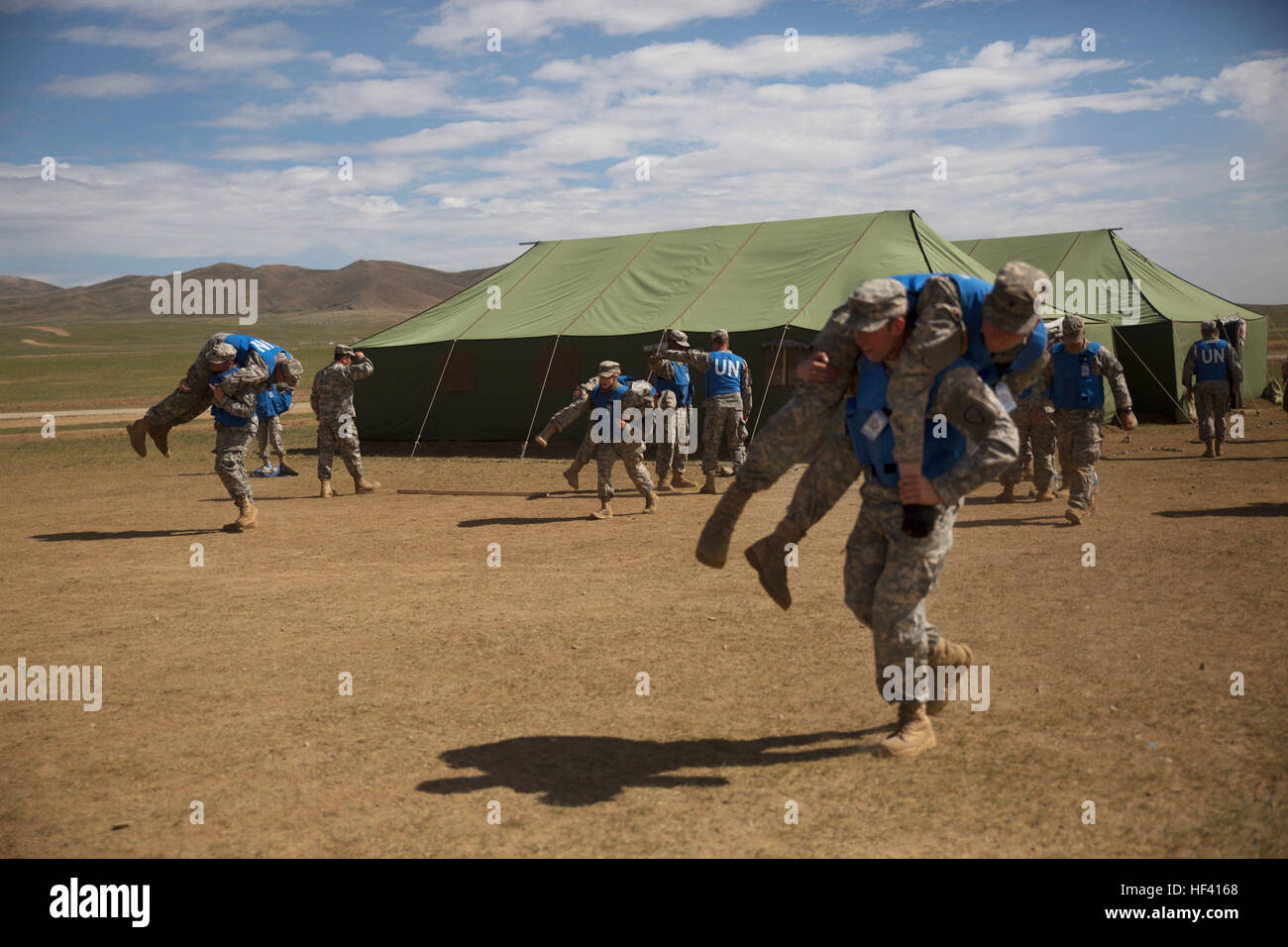 U.S. Soldiers with the Alaska Army National Guard practice patient transportation techniques during the combat medical care training lane of Khaan Quest 2016 at Five Hills Training Area near Ulaanbaatar, Mongolia, May 30. The training equipped soldiers with essential life-saving skills and the ability to prioritize injuries and medical care. Khaan Quest 2016 is an annual, multinational peacekeeping operations exercise hosted by the Mongolian Armed Forces, co-sponsored by U.S. Pacific Command, and supported by U.S. Army Pacific and U.S. Marine Corps Forces, Pacific. Khaan Quest, in its 14th ite Stock Photo