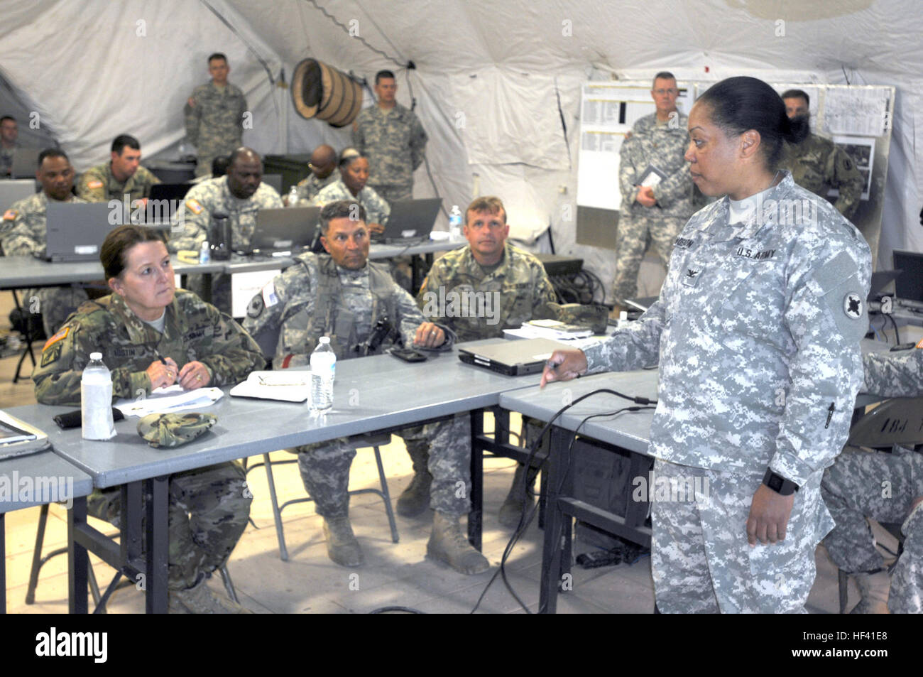 Col. Cheryl Anderson (right), chief of staff, 184th Sustainment Command, headquartered at Laurel, Miss., briefs Maj. Gen. Elizabeth Austin (left), assistant deputy commanding general, Army National Guard, Army Material Command, on the logistics employed to move more than 3,000 Soldiers of the Mississippi National Guard from their home state to Fort Hood, Texas, and sustain them during the weeks of the Multi-echelon Integrated Brigade Training exercise currently underway. Col. Jeffrey Van (center), 155th Armored Brigade Combat Team commander, also briefed Anderson on his unit’s experience so fa Stock Photo