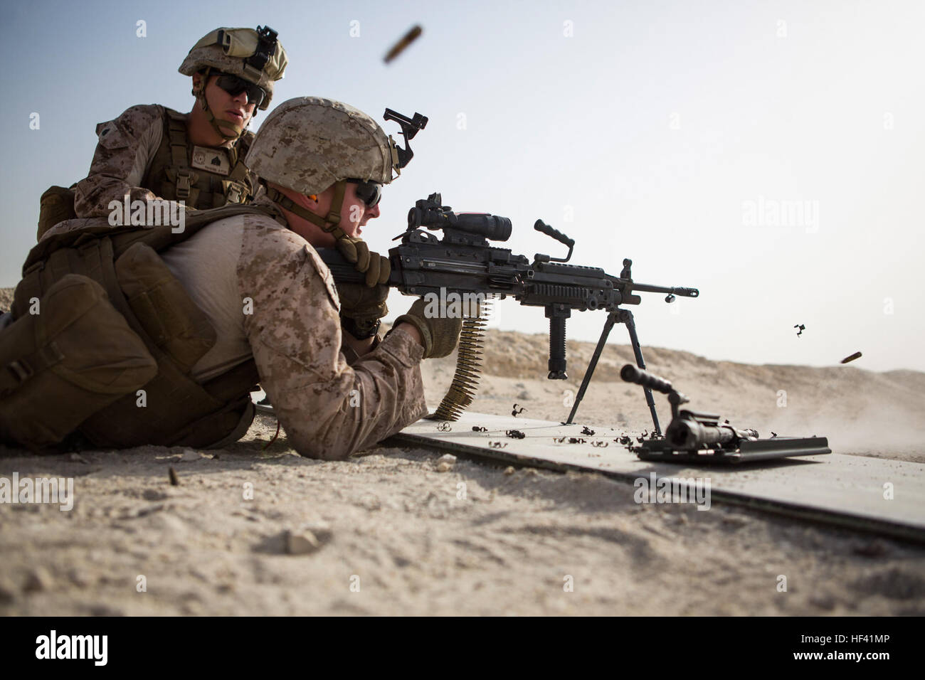 U.S. Marine Corps Cpl. Kyle Hancock, a fire team leader with Company C, Marine Wing Support Squadron 373, Special Purpose Marine Air Ground Task Force - Crisis Response - Central Command 16.2, fires an M249 light machine gun during a familiarization range at an undisclosed location in Southwest Asia, June 8, 2016. SPMAGTF-CR-CC is forward deployed in several host nations, with the ability to respond to a variety of contingencies rapidly and effectively. (U.S. Marine Corps photo by Sgt. Donald Holbert/ Released) Security Force Marines learn to employ machine guns 160608-M-HB658-015 Stock Photo