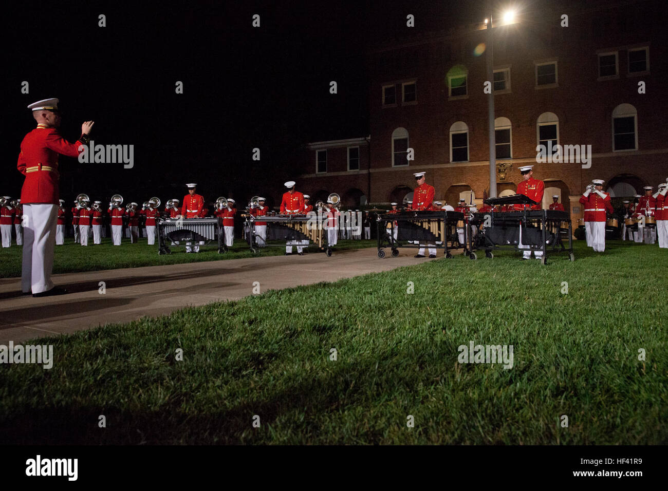 U.S. Marines with Marine Barracks Washington (MBW) performs during an evening parade in MBW, D.C., June 10, 2016. The evening parade summer tradition began in 1934 and features the Silent Drill Platoon, the U.S. Marine Band, the U.S. Marine Drum and Bugle Corps and two marching companies. More than 3,500 guests attend the parade every week. (U.S. Marine Corps photo by Lance Cpl. Kayla. V. Staten/ Released) June 10 Evening Parade 061016-M-DG059-188 Stock Photo
