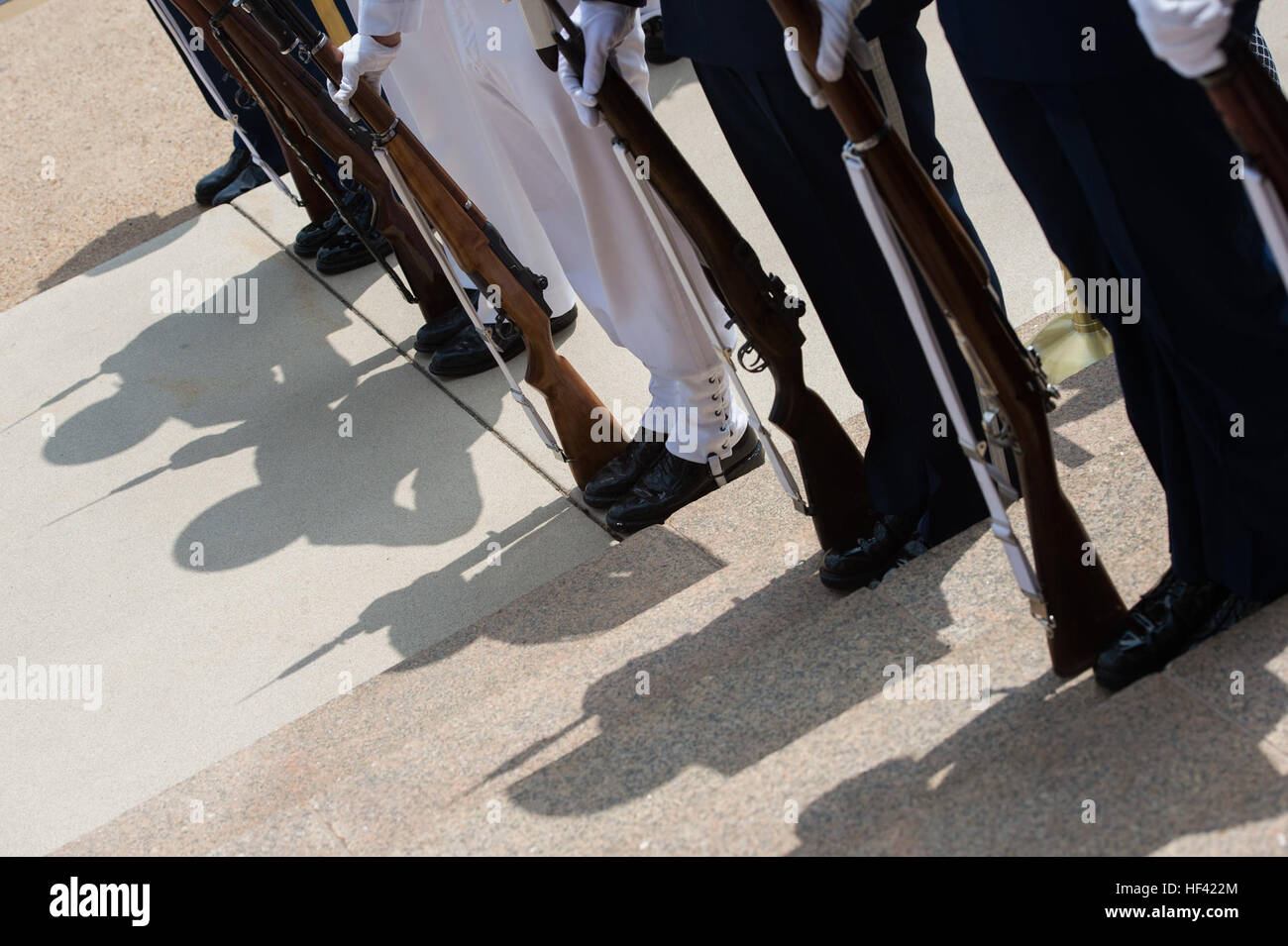 A joint honor guard stands in place as Secretary of Defense Ash Carter ...