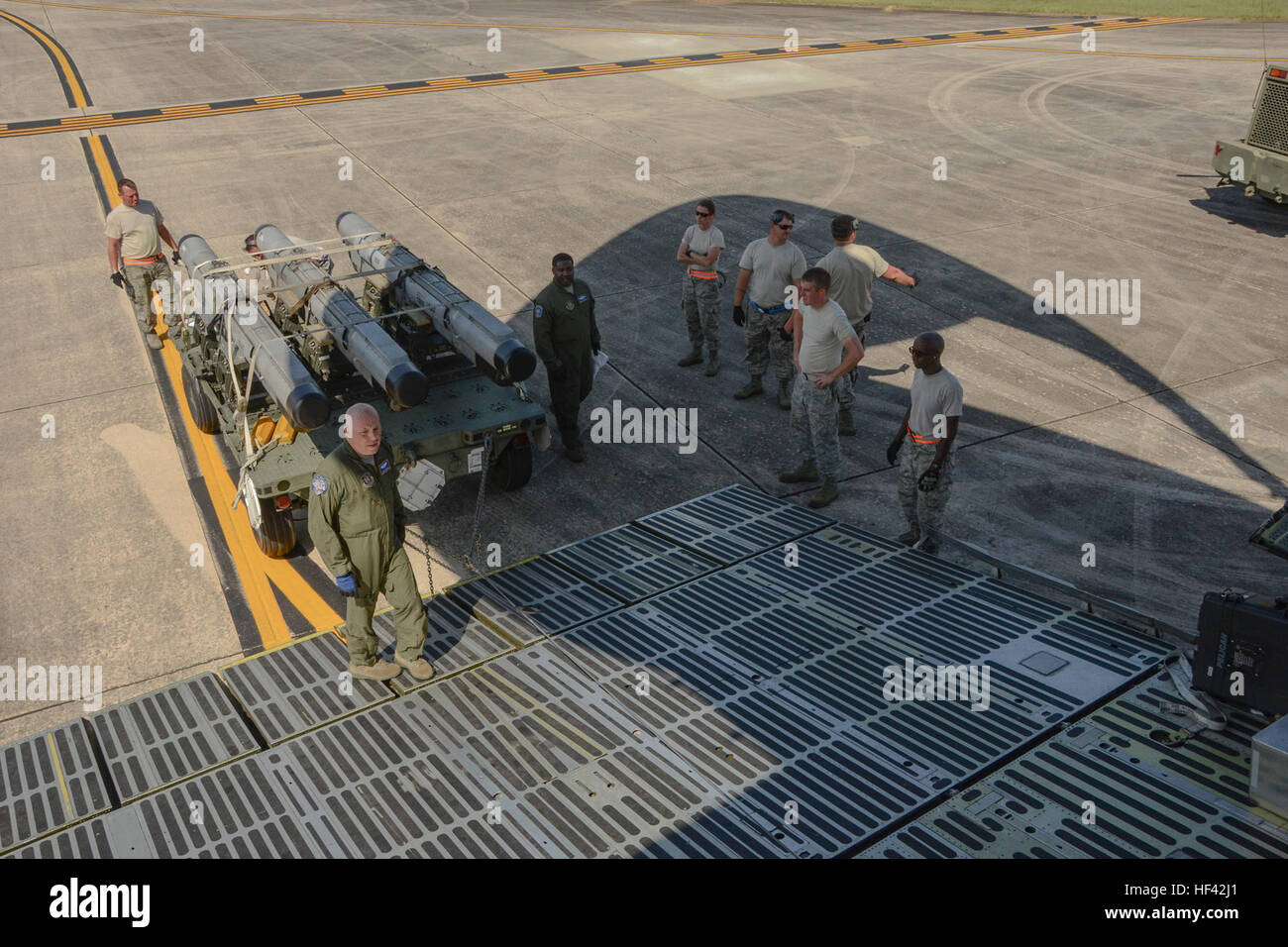 U.S. Air Force Master Sgt. Dan Warman, a loadmaster assigned to the 709th Airlift Squadron, demonstrates how to load cargo onto a U.S. Air Force Lockheed C-5 Galaxy transport aircraft at McEntire Joint national Guard Base, S.C., July 8, 2016. Approximately 300 U.S. Airmen and 12 F-16 Fighting Falcons from the 169th Fighter Wing at McEntire JNGB, S.C., are deploying to Osan Air Base, Republic of Korea, as the 157th Expeditionary Fighter Squadron in support of the U.S. Pacific Command Theater Security Package. (U.S. Air National Guard photo by Airman 1st Class Megan Floyd) SCANG TSP 747 Cargo Lo Stock Photo