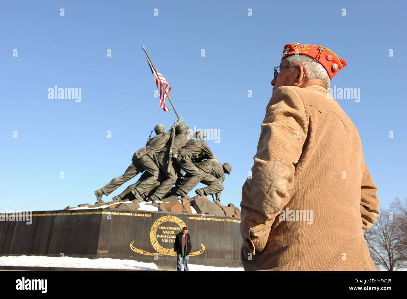 William H. Toledo, a U.S. Marine Corps World War II veteran, looks at the Marine Corps War Memorial statue before the wreath laying ceremony commemorating the 65th anniversary of the Battle of Iwo Jima at Arlington, Va., Feb. 19, 2010. Toledo is a surviving Navajo code talker who fought in the battle. (U.S. Marine Corps photo by Sgt. Alvin Williams/Released) Defense.gov photo essay 100219-M-1549W-012 Stock Photo