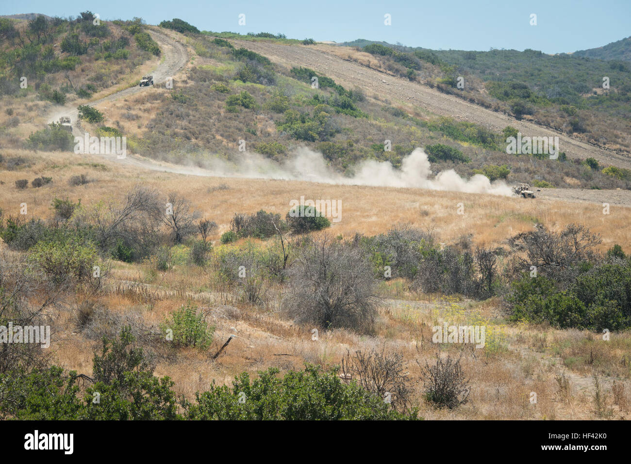 Marines with 3rd Battalion, 5th Marine Regiment rush to provide support for other Marines in an Internally Transportable Vehicle - Replacement at Marine Corps Base Camp Pendleton, Calif., July 13, 2016. The system was built by the Marine Corps Warfighting Laboratory, which is conducting a Marine Air-Ground Task Force Integrated Experiment in conjunction with Rim of the Pacific exercise to explore new gear and assess its capabilities for potential future use. The Warfighting Lab identifies possible challenges of the future, develops new warfighting concepts, and tests new ideas to help develop  Stock Photo