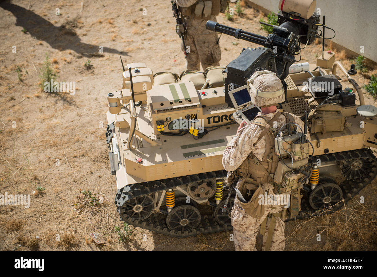 Marines with 3rd Battalion, 5th Marine Regiment prepare a Weaponized Multi-Utility Tactical Transport vehicle for a patrol at Marine Corps Base Camp Pendleton, Calif., July 13, 2016. The system is a multifunction force multiplier configured to persist, protect and project the small unit built by the Marine Corps Warfighting Laboratory. The lab is conducting a Marine Air-Ground Task Force Integrated Experiment in conjunction with Rim of the Pacific exercise to explore new gear and assess its capabilities for potential future use. The Warfighting Lab identifies possible challenges of the future, Stock Photo