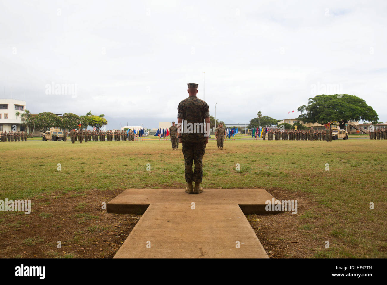 MARINE CORPS BASE HAWAII - Col. Carl E. Cooper, the commanding officer for 3d Marine Regiment, calls the battalion to attention at the 1st Battalion, 3rd Marine Regiment change of command ceremony held at Dewey Square aboard Marine Corps Base Hawaii, July 22, 2016. Lt. Col. Jeremiah Salame, the incoming commanding officer for 1st Bn., 3rd Marines, relieved Lt. Col. Quintin Jones, the outgoing commanding officer for 1st Bn., 3rd Marines, after Jones served four years as 1st Bn., 3rd Marines' commanding officer. The change of command ceremony represents a transfer of authority and responsibility Stock Photo