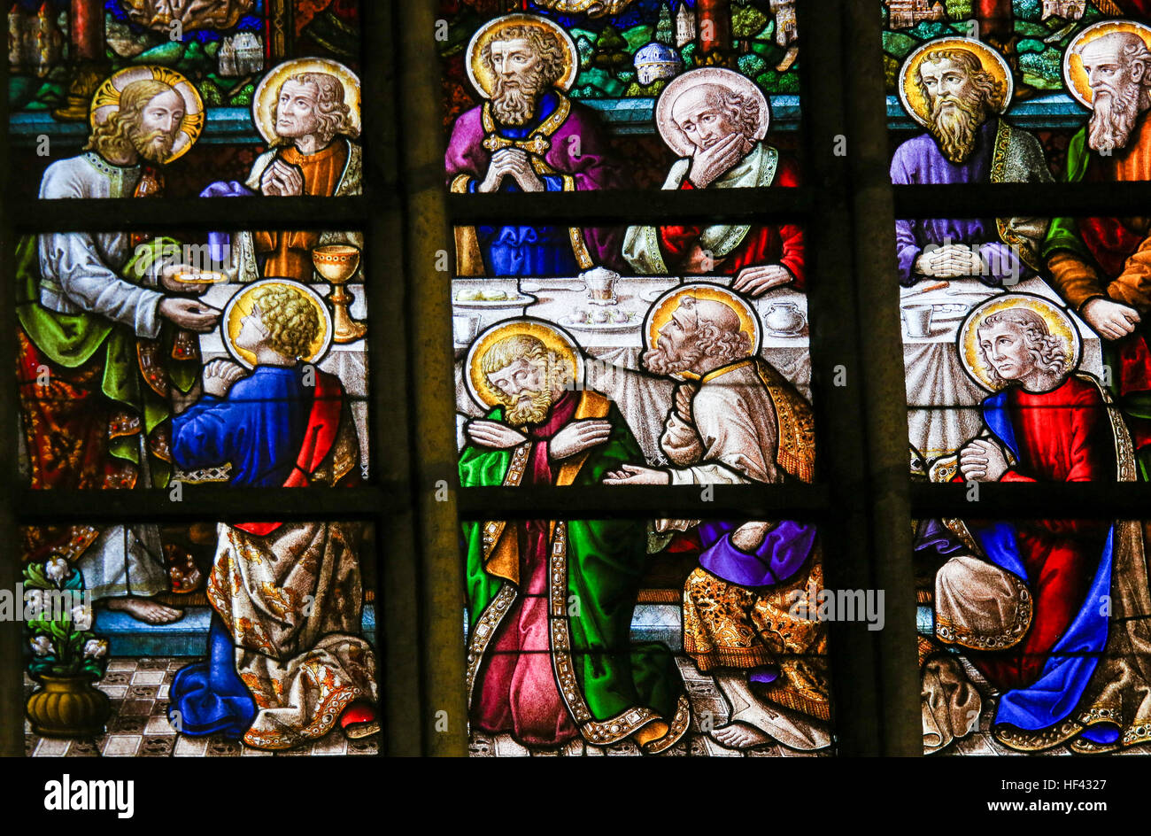 Stained Glass window depicting the Last Supper on Maundy Thursday, in the Cathedral of Saint Bavo in Ghent, Flanders, Belgium. Stock Photo