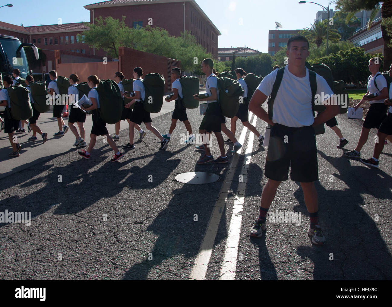 TUCSON, Arizona (Aug. 13, 2016) – Naval Reserve Officers Training Corps Midshipman Candidate Tanner Turnbow guards traffic Aug. 13, 2016, as the NROTC unit’s freshman New Student Orientation platoon boards a bus for Camp Navajo, Arizona, to participate in joint NSO training there.  The weeklong NSO training took place Aug. 12-19 at both Camp Navajo, Arizona, alongside two other university NROTC units, and at The University of Arizona in Tucson, Arizona.  The joint regional training was the first combined evolution of its kind for The University of Arizona.  (U.S. Marine Corps photo by Gunnery  Stock Photo