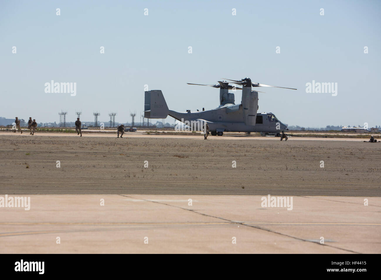 Marines with 3rd Battalion, 5th Marine Regiment, 1st Marine Division, exit from an MV-22 Osprey and post security to demonstrate the Marine Air Ground Task Force’s capabilities during the 2016 Marine Corps Air Station (MCAS) Miramar Air Show at MCAS Miramar, Calif., Sept. 23, 2016. The MCAS Miramar Air Show honors 100 years of the Marine Corps Reserves by showcasing aerial prowess of the Armed Forces and their appreciation of the civilian community’s support to the troops. (U.S. Marine Corps photo By Corporal Jessica Y. Lucio/Released) MCAS Miramar Air Show 160923-M-UX416-003 Stock Photo