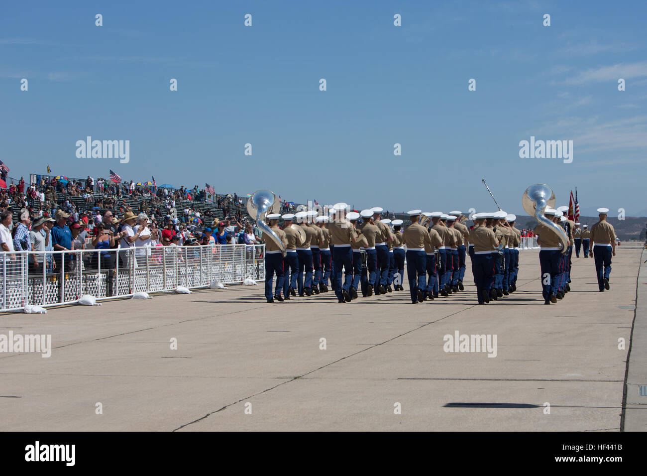 The 3d Marine Aircraft Wing Band performs a musical rendition while marching at the 2016 Marine Corps Air Station (MCAS) Miramar Air Show at MCAS Miramar, Calif., Sept. 23, 2016. The MCAS Miramar Air Show honors 100 years of the Marine Corps Reserves by showcasing aerial prowess of the Armed Forces and their appreciation of the civilian community’s support to the troops. (U.S. Marine Corps photo By Corporal Jessica Y. Lucio/Released) MCAS Miramar Air Show 160923-M-UX416-024 Stock Photo