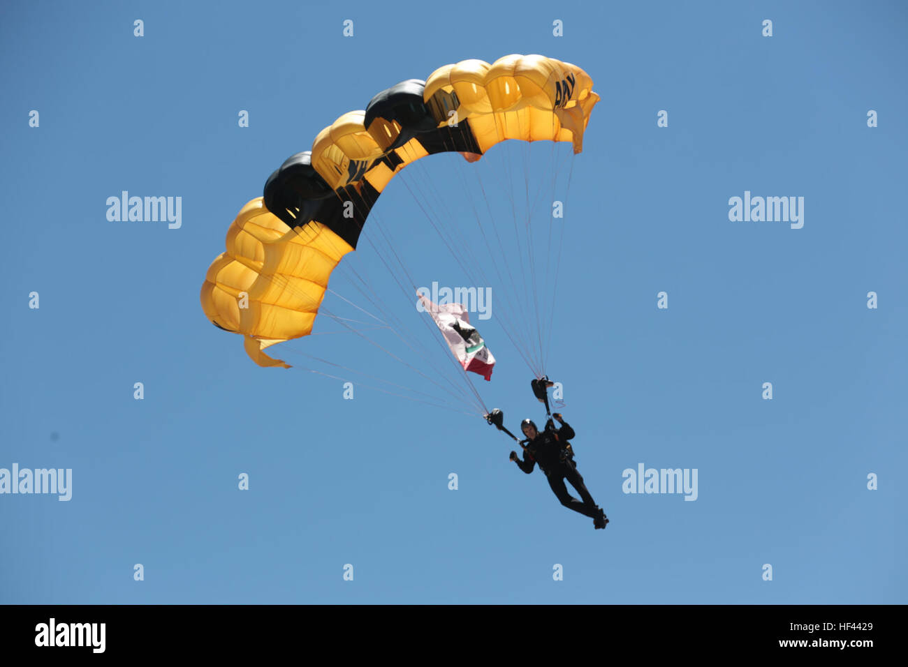 A U.S. Army soldier from the Golden Knights Parachute Team, free falls during the 2016 Marine Corps Air Station (MCAS) Miramar Air Show at MCAS Miramar, Calif., Sept. 24, 2016. The MCAS Miramar Air Show honors 100 years of the Marine Corps Reserves by showcasing aerial prowess of the Armed Forces and their appreciation of civilian community’s support to the troops. (U.S. Marine Corps photo by Pfc. Nadia J. Stark/Not Released) 2016 MCAS Miramar Air Show 160924-M-BV291-176 Stock Photo