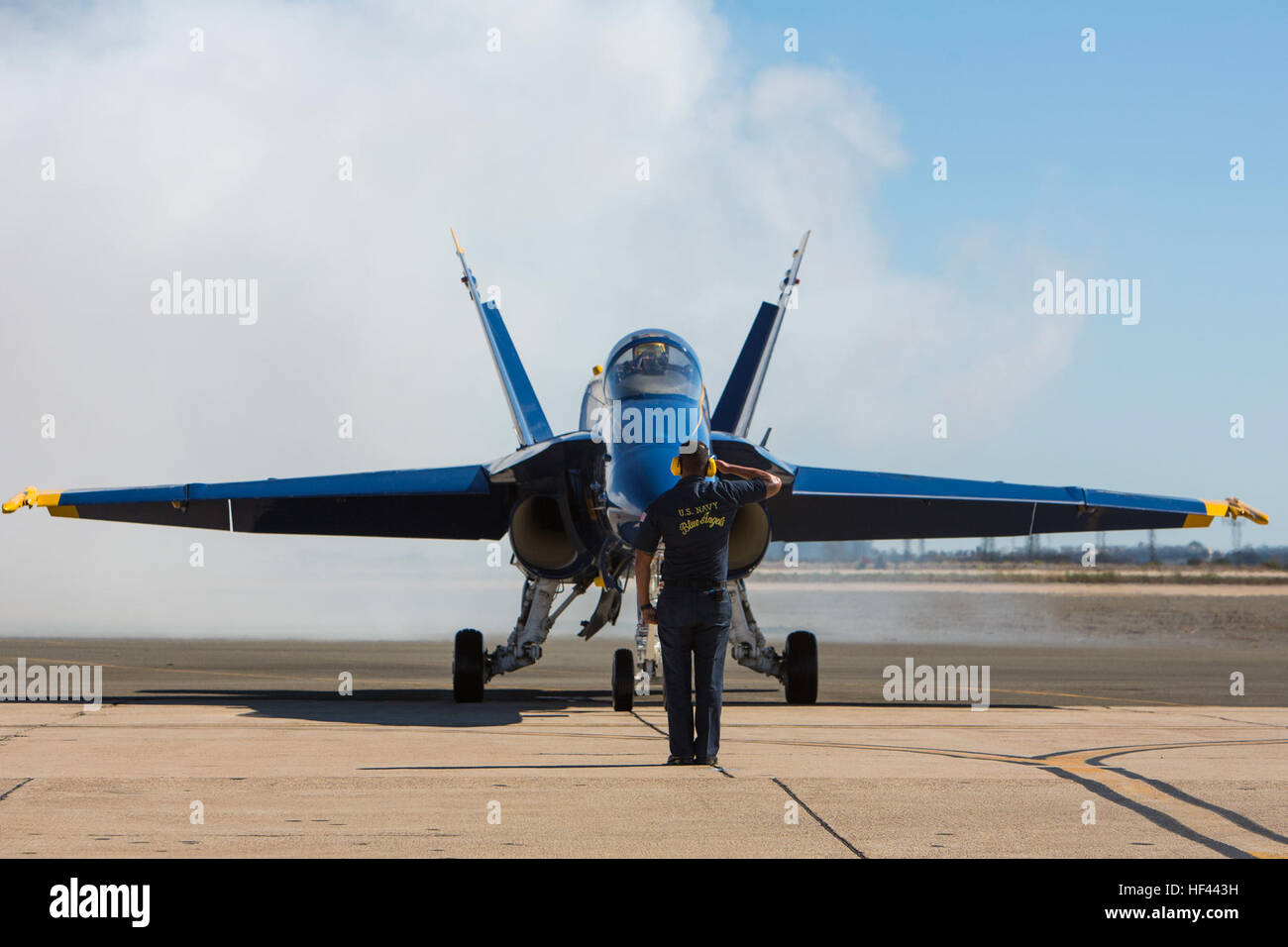 A U.S. Navy Blue Angels crew member renders his salute to a Blue Angels pilot before takeoff during the 2016 Marine Corps Air Station (MCAS) Miramar Air Show at MCAS Miramar, Calif., Sept. 24, 2016. The MCAS Miramar Air Show honors 100 years of the Marine Corps Reserves by showcasing aerial prowess of the Armed Forces and their appreciation of the civilian community’s support to the troops. (U.S. Marine Corps photo By Corporal Jessica Y. Lucio/Released) MCAS Miramar Air Show 160924-M-UX416-003 Stock Photo