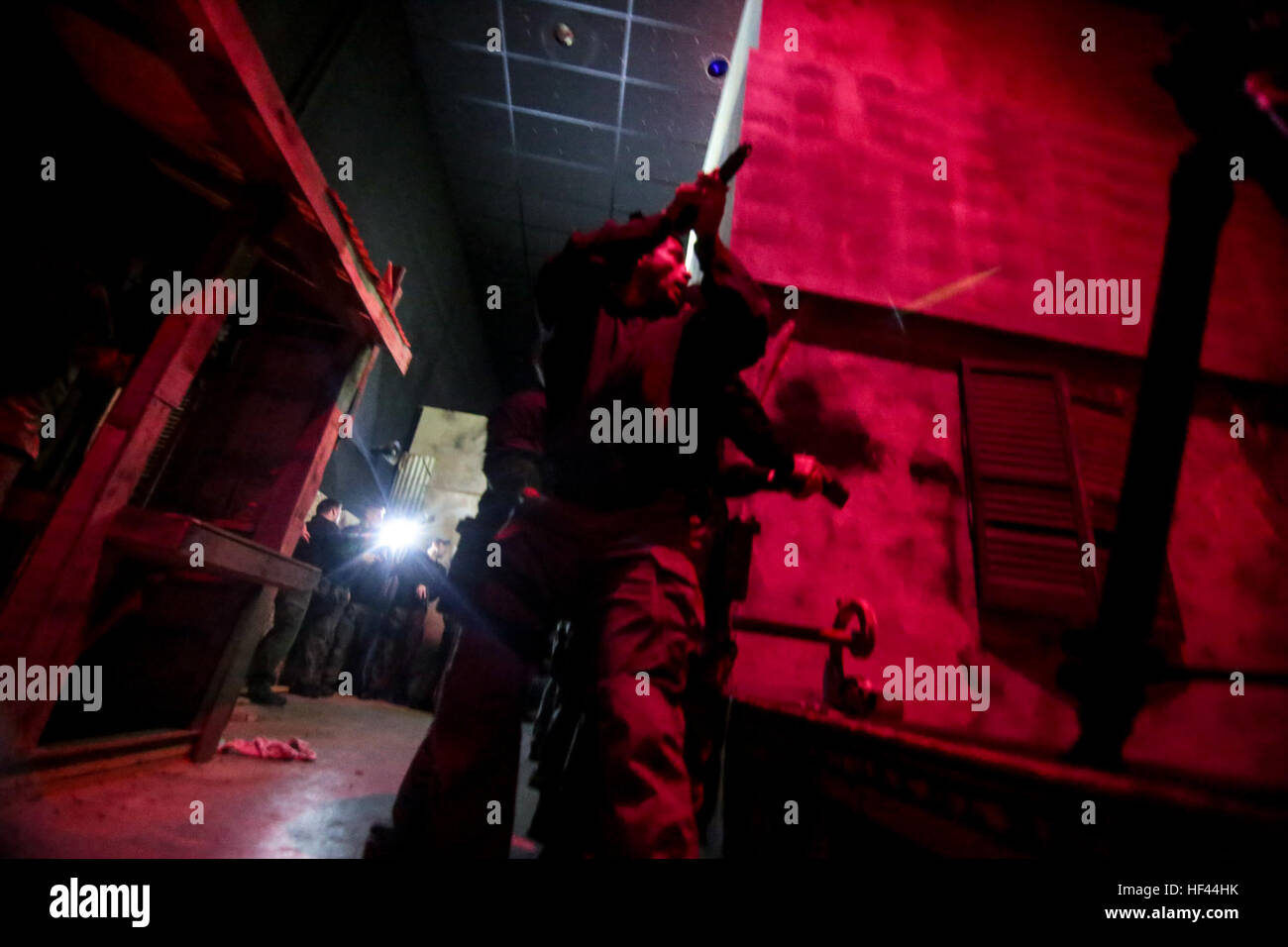 Police Officers assigned to the Atlantic City Special Weapons and Tactics (SWAT) team clear an indoor urban area during low light tactical training at the New Jersey National Guard's Joint Training and Training Development Center (JT2DC), Joint Base McGuire-Dix-Lakehurst, N.J., Oct. 14, 2016. The JT2DC is used by the military, civil authorities, and foreign allies for training and features the Virtual Interactive Combat Environment (VICE), indoor Military Operations in Urban Terrain (MOUT) Immersion/Night Fighting Lanes, Call For Fire Trainer (CFFT) and Immersion Lane, Engagement Skills Traine Stock Photo