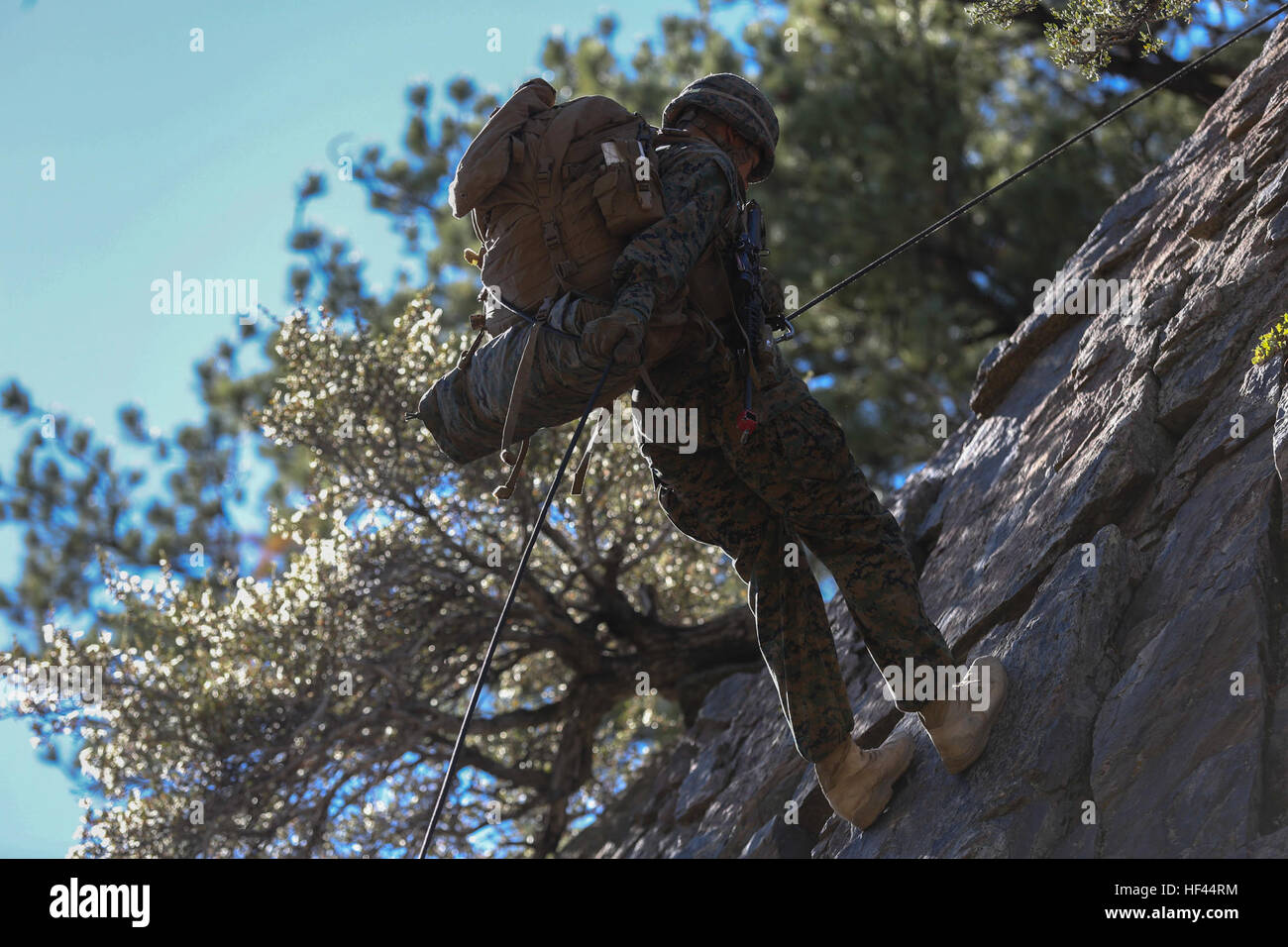 A Marine with Company L, 3rd Battalion, 4th Marine Regiment, rappels ...