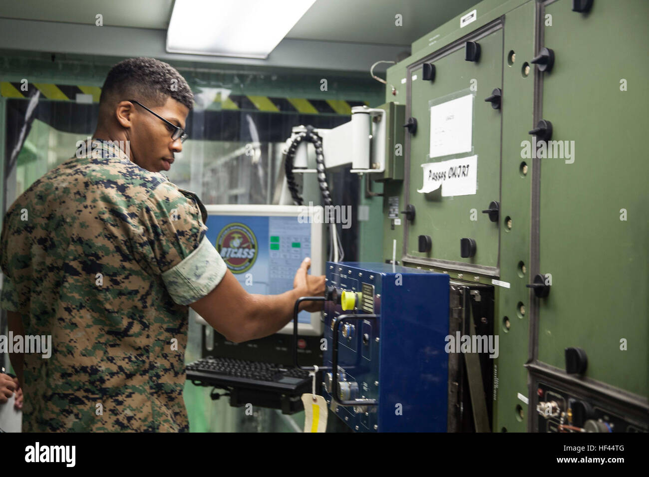U.S. Marine Corps Lance Cpl. Emmanuel I. Fitzgerald, an aviation electrician assigned to Marine Aviation Logistics Squadron (MALS) 29, operates the Reconfigurable Transportable Consolidated Automated Support System aboard Marine Corps Air Station New River, N.C., Oct 18, 2016. MALS-29’s mission is to provide aviation logistics support, guidance, planning, and direction to other squadrons within the Marine Aircraft Group, as well as logistics support for Navy funded equipment in the supporting Marine Wing Support Squadron, Marine Air Control Group, and Marine Aircraft Wing/Mobile Calibration Co Stock Photo