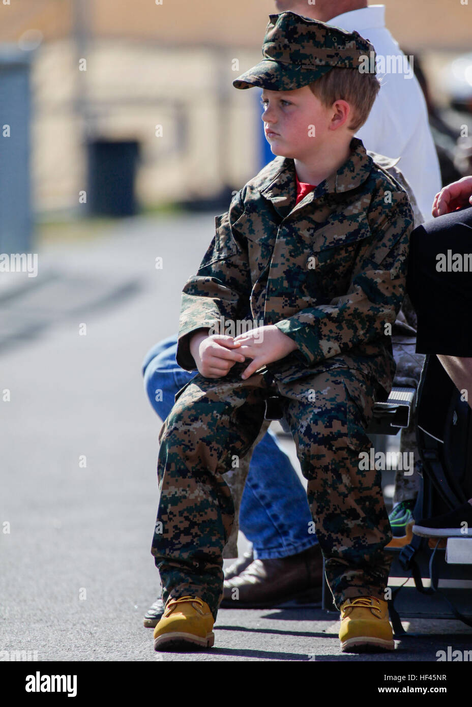 A young boy dressed in camouflage sits in the stands during the annual Marine Corps Birthday Pageant commemorating 241 years of the United States Marine Corps on Camp Pendleton, Calif., Nov. 9, 2016 (U.S. Marine Corps photo by GySgt Ismael Pena) MCI-West-IMEF Celebrate the 241st Marine Corps Birthday 161109-M-CX588-135 Stock Photo