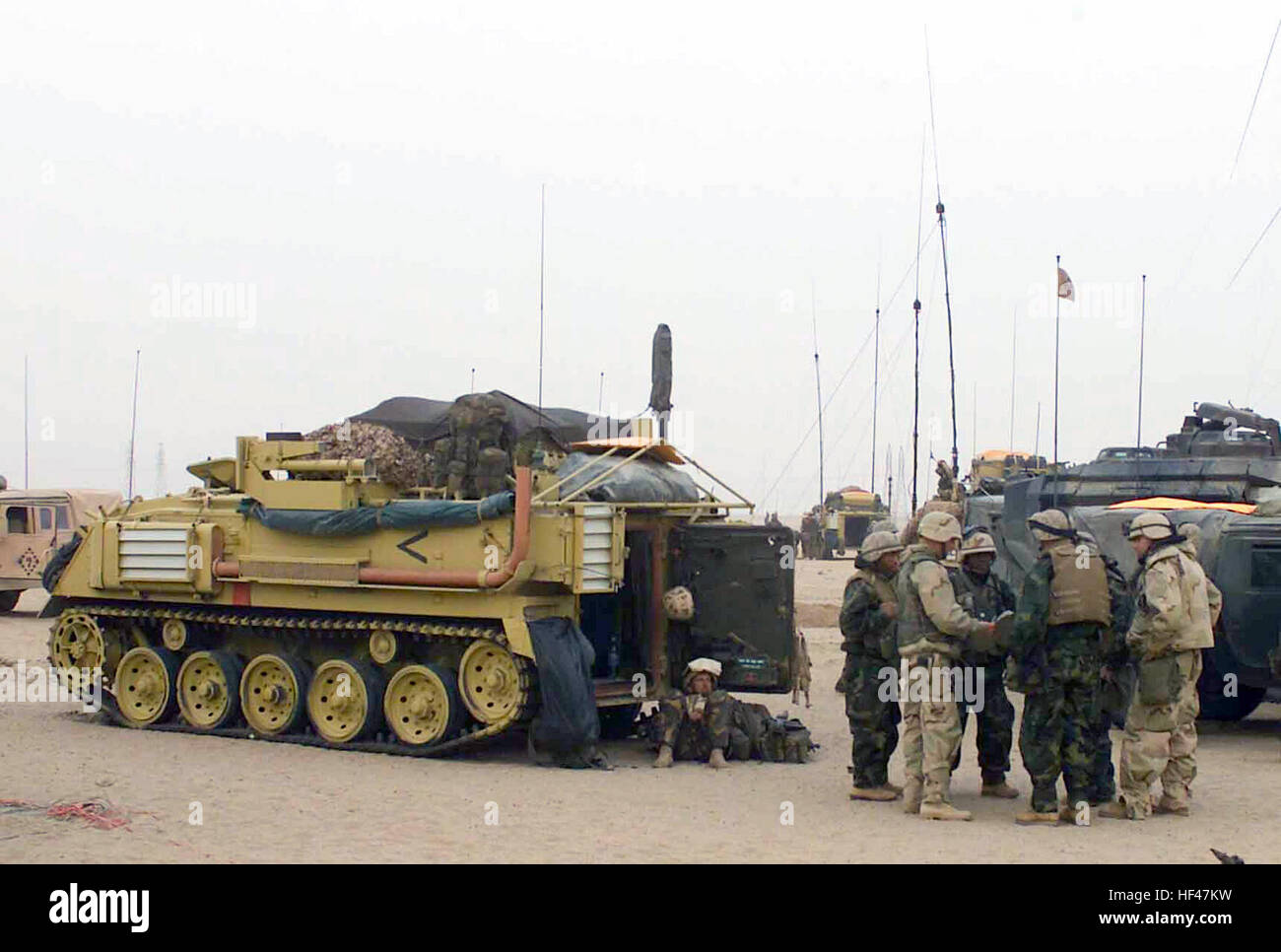 Next to a United Kingdom FV432 Armored Personnel Carrier, British