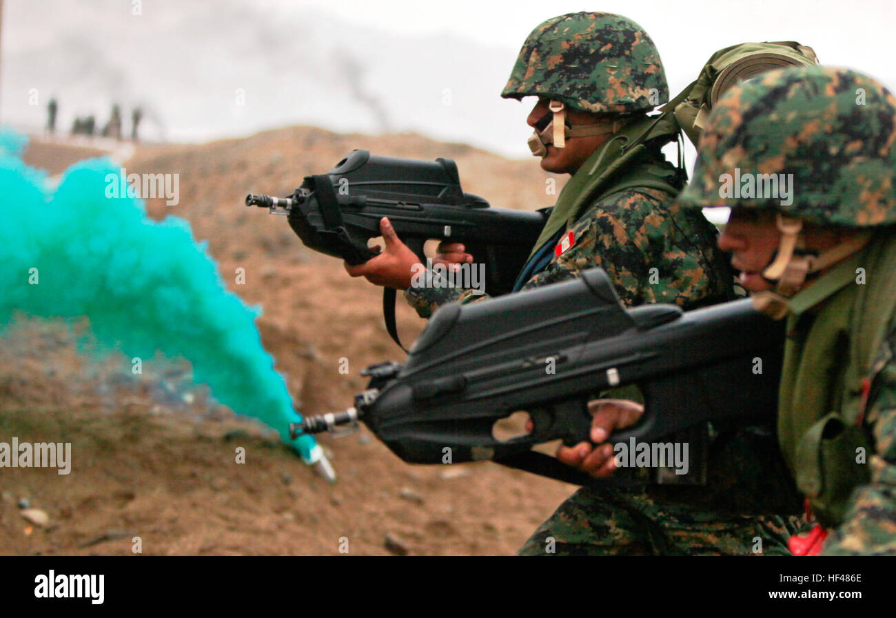Peruvian marines carrying F2000 assault rifles assault a beach 