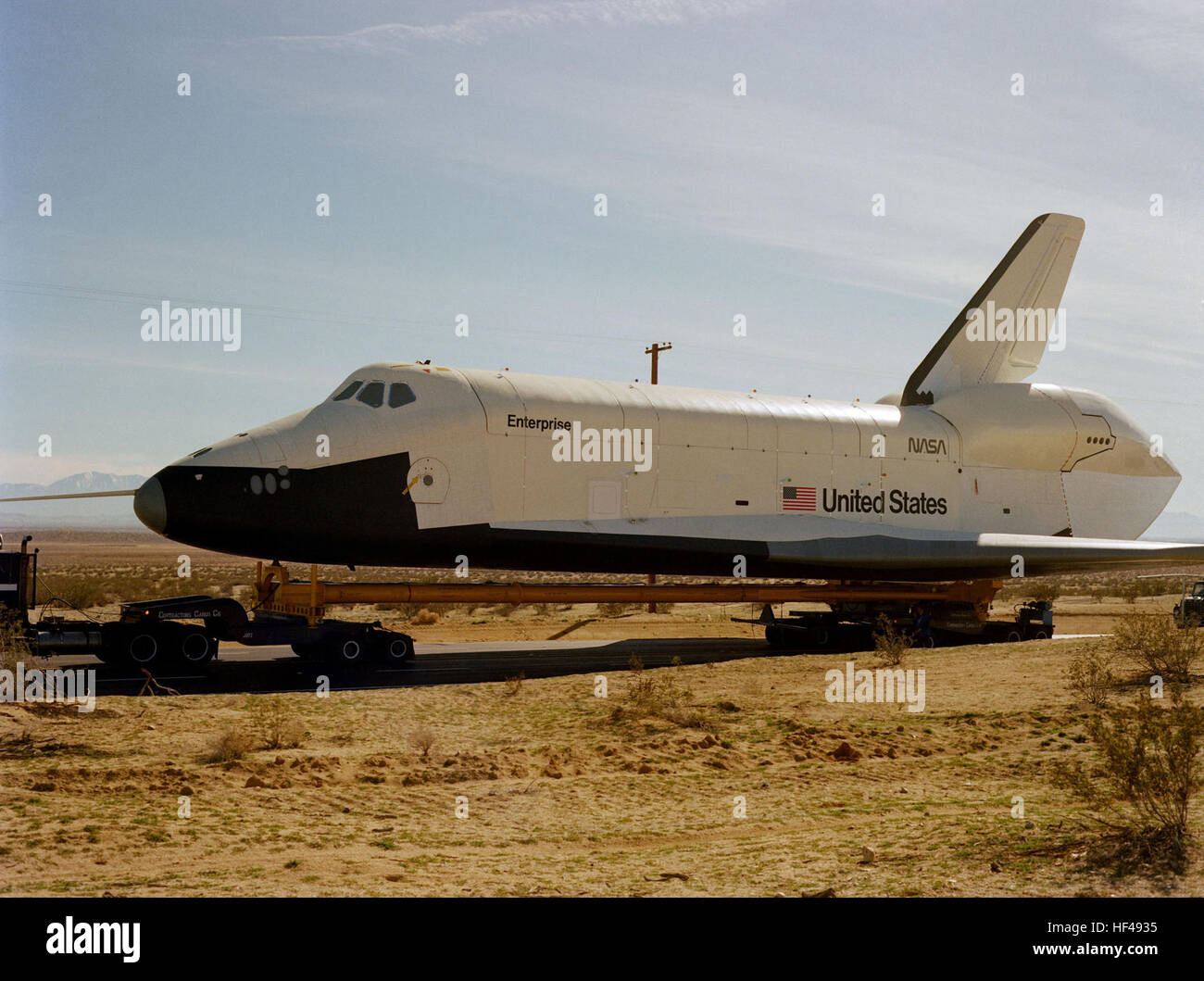 A left side view of the Space Shuttle Orbiter Enterprise as it arrives at  the base. Enterprise arriving at Edwards Air Force Base by tractor trailer  - DF-SC-84-04924 Stock Photo - Alamy