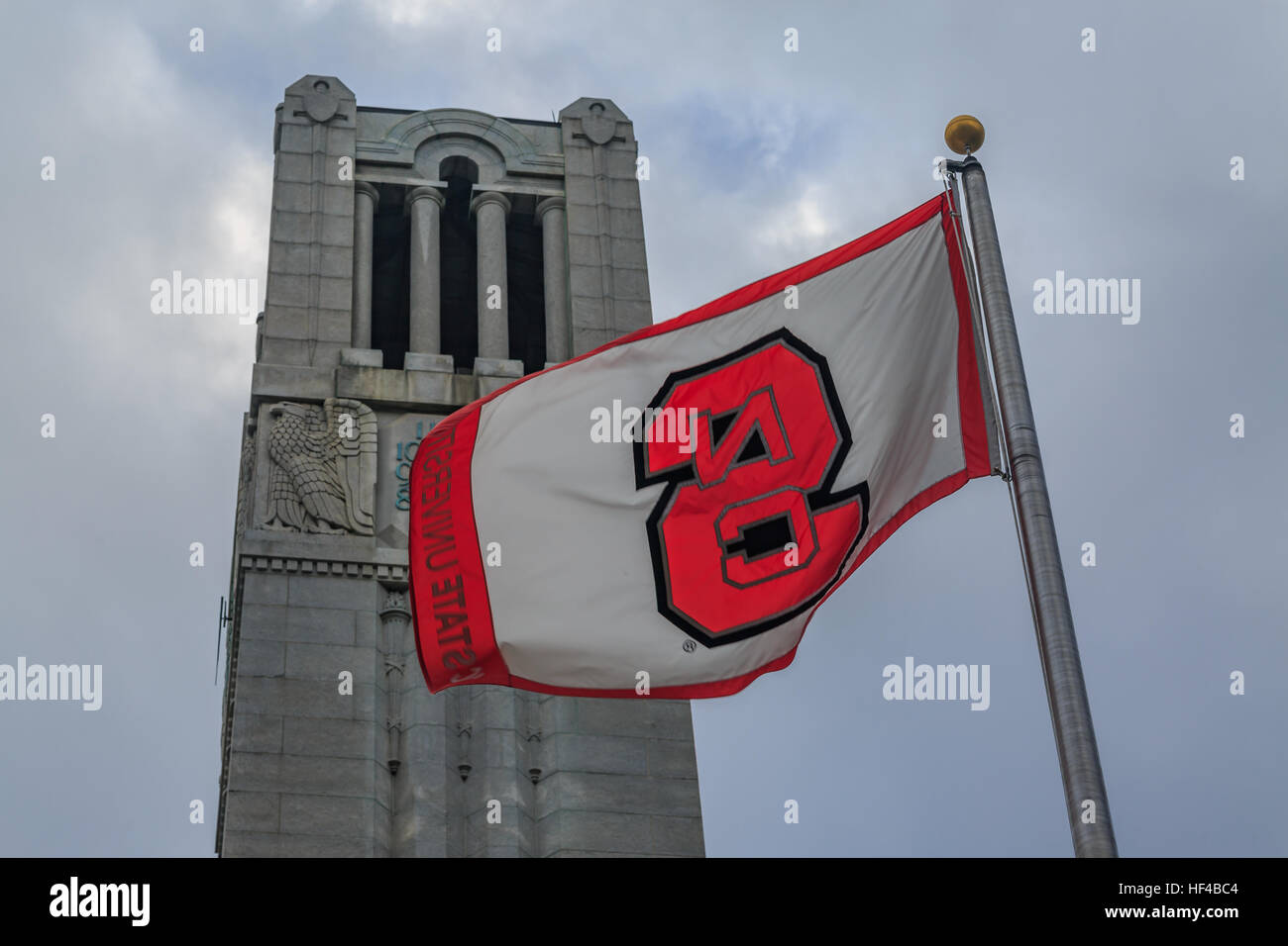 North Carolina State university flag with bell tower. Stock Photo