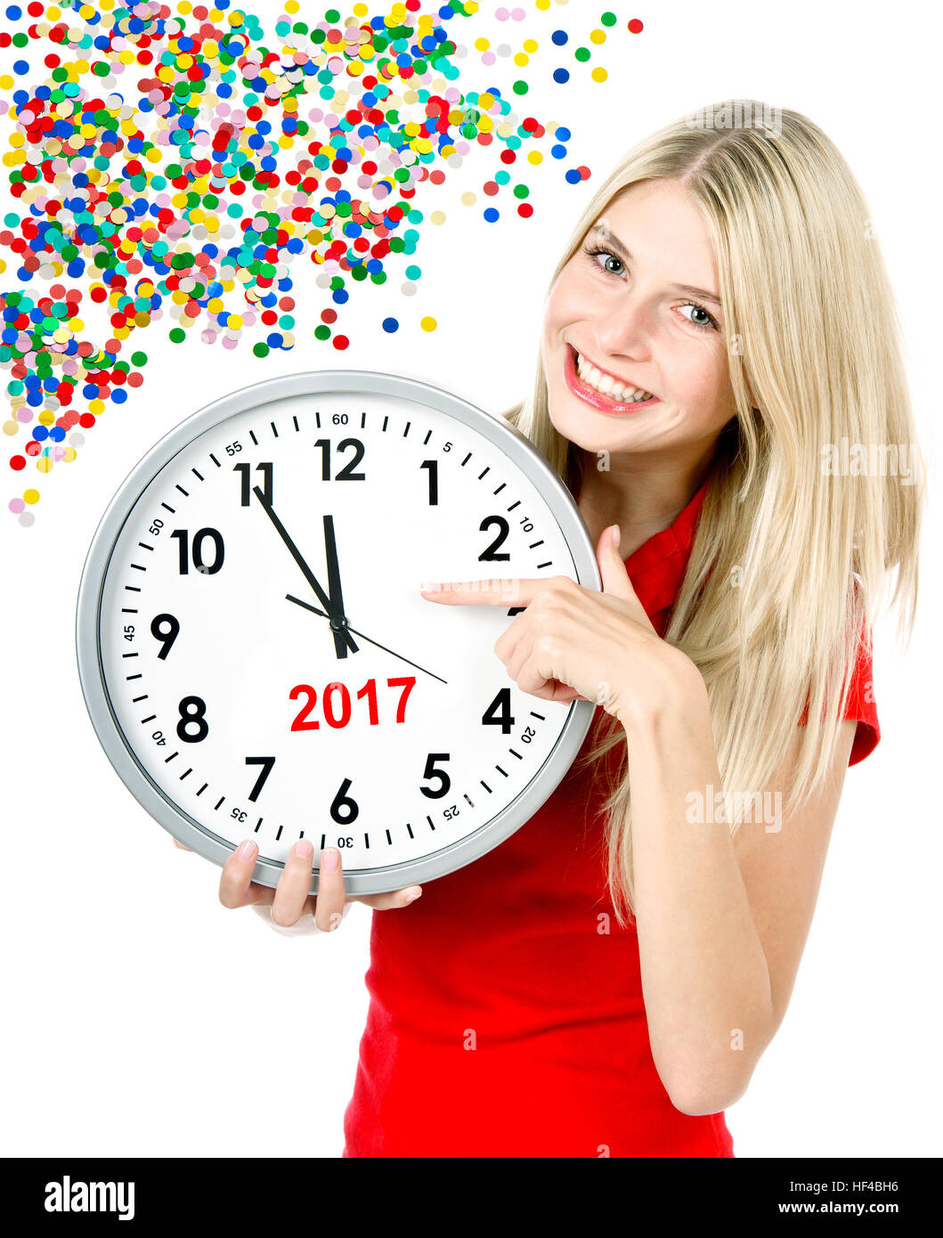New Year 2017. Five to twelve. Young beautiful woman with big clock and party decoration Stock Photo