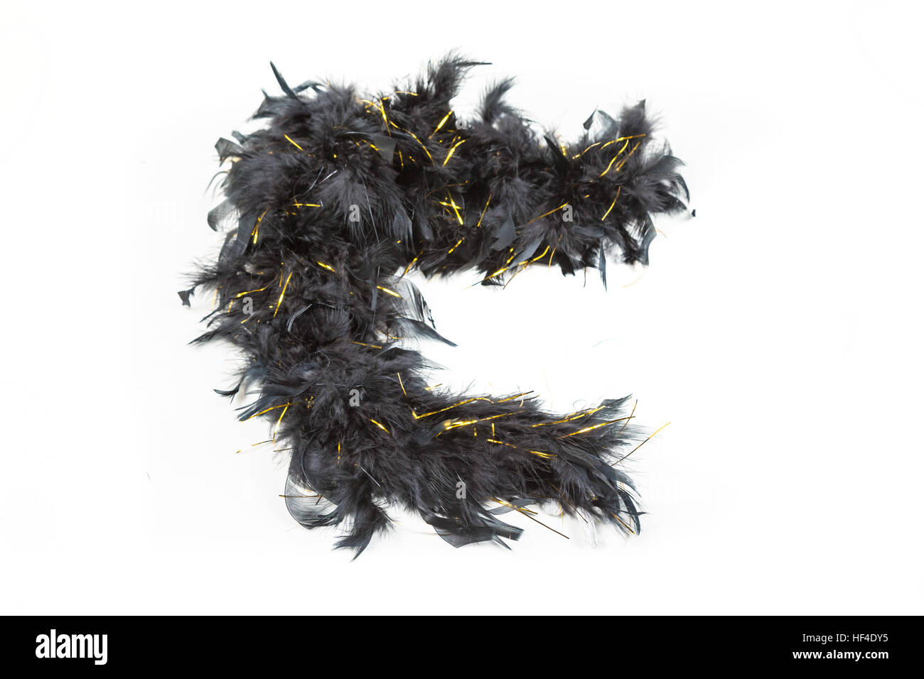 Black feather boa with gold tinsel isolated on white background Stock